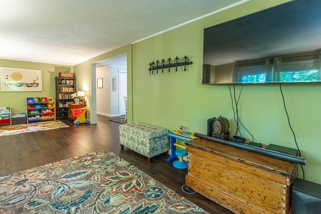 9 Holden Road Shirley, MA 01464 - Photo 7 of 42 a bedroom with furniture and a wooden floor