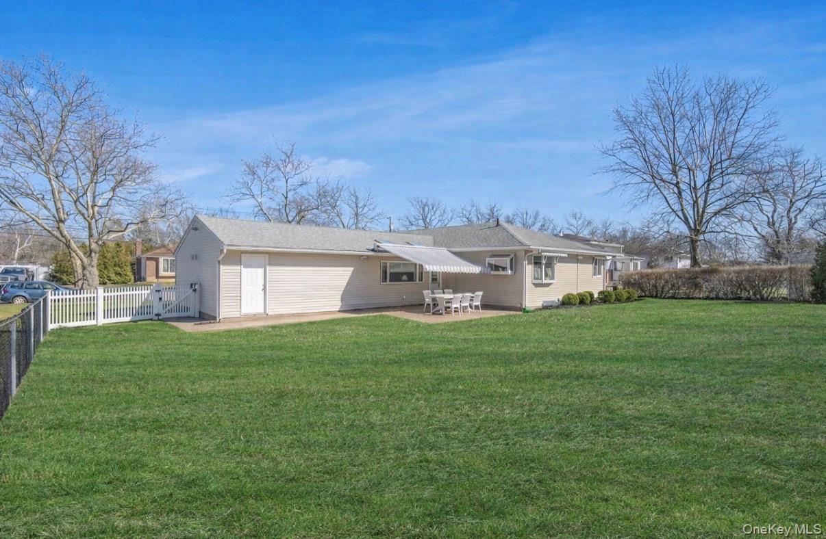 8 Leeward Lane Commack, NY 11725 - Photo 15 of 17 a view of a house with backyard and garden