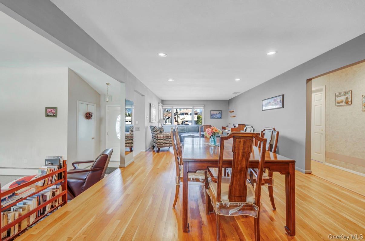 8 Leeward Lane Commack, NY 11725 - Photo 3 of 17 a view of a dining room with furniture and wooden floor