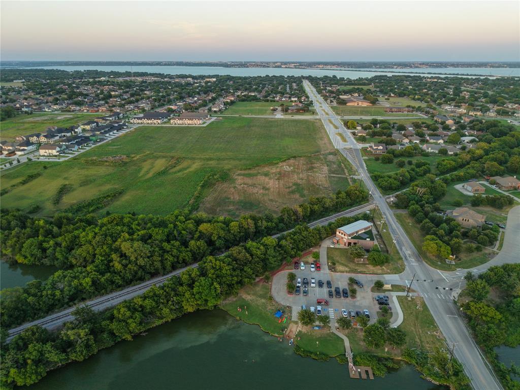 6921 Miller Road Rowlett, TX 75088 - Photo 2 of 4 an aerial view of residential houses with outdoor space and river