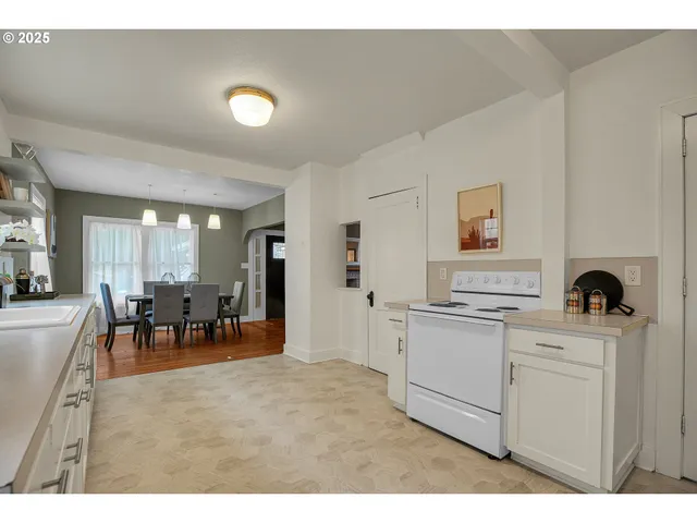 a kitchen with furniture and windows
