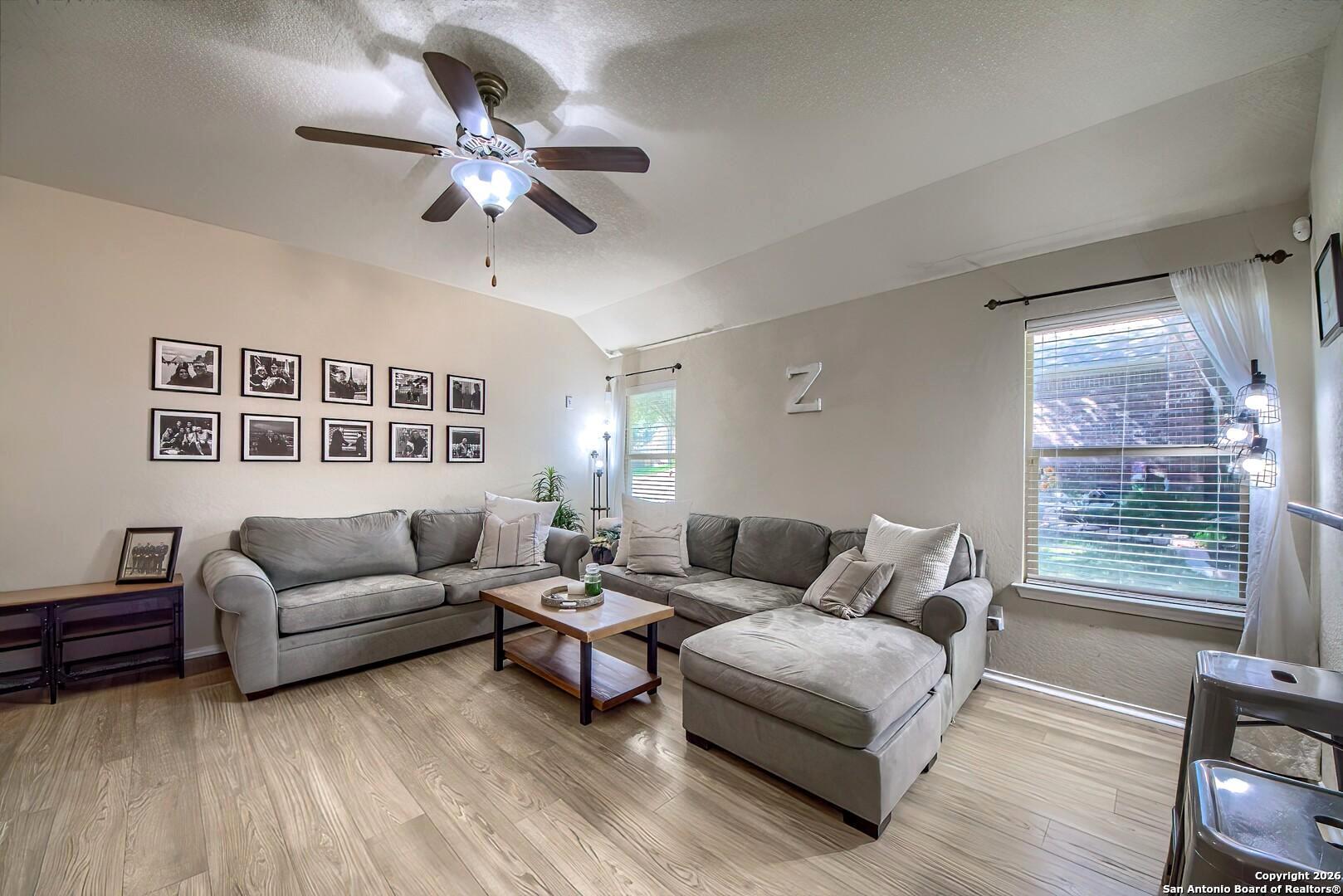 200 Stetson Street Cibolo, TX 78108 - Photo 1 of 28 a living room with furniture and a large window