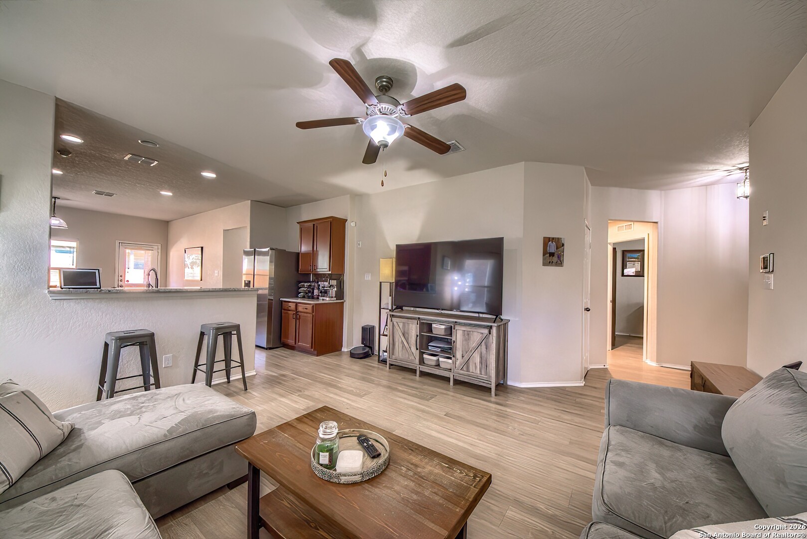 200 Stetson Street Cibolo, TX 78108 - Photo 6 of 28 a living room with furniture and a flat screen tv