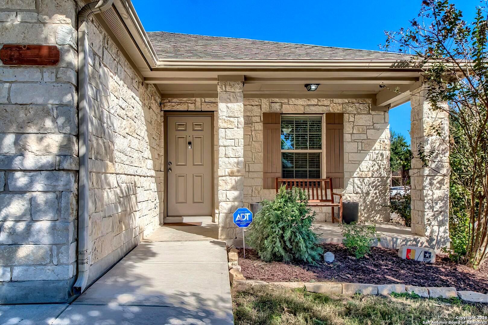 200 Stetson Street Cibolo, TX 78108 - Photo 10 of 28 a front view of a house with a large window and potted plants