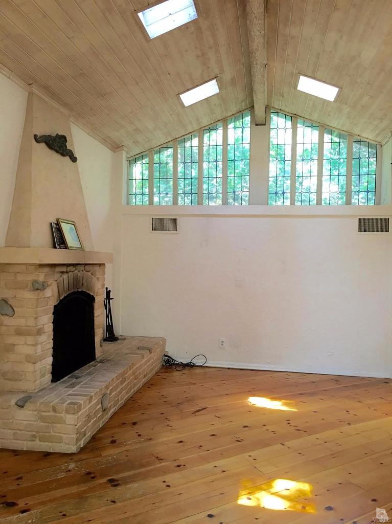 212 Dirt Road Lake Sherwood, CA 91361 - Photo 3 of 41 a view of empty room with window and fireplace