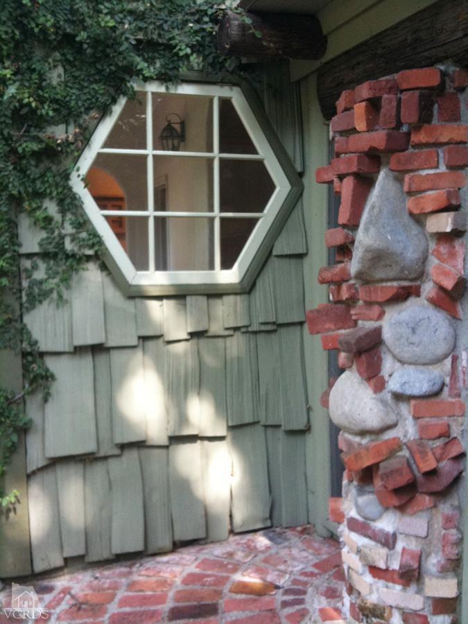 212 Dirt Road Lake Sherwood, CA 91361 - Photo 24 of 41 a front view of a house with wooden floor
