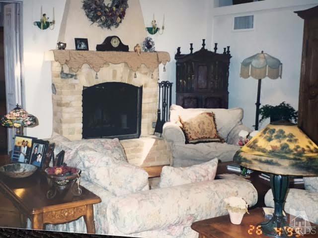 212 Dirt Road Lake Sherwood, CA 91361 - Photo 31 of 41 a living room with furniture and a fireplace