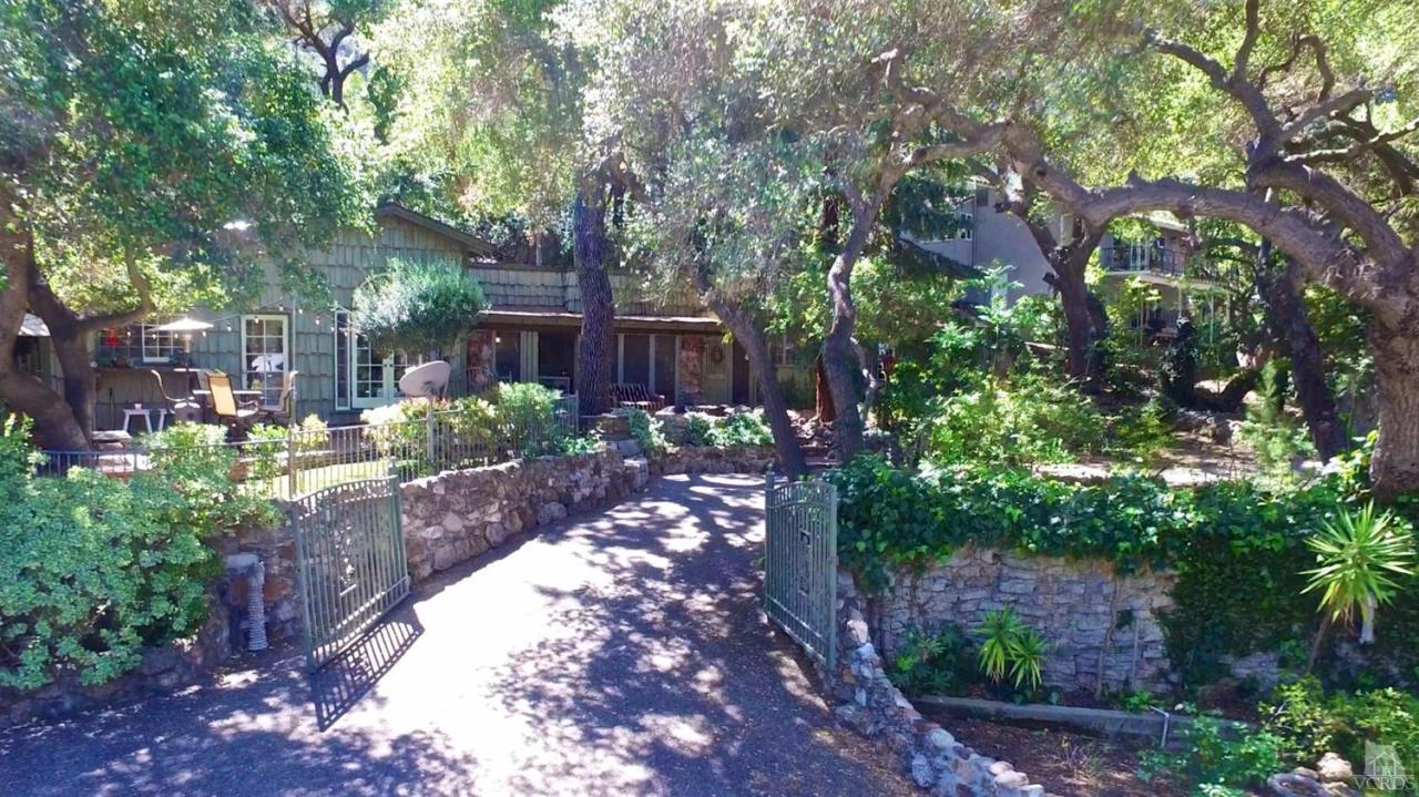 212 Dirt Road Lake Sherwood, CA 91361 - Photo 38 of 41 a view of a backyard house with lots of green space