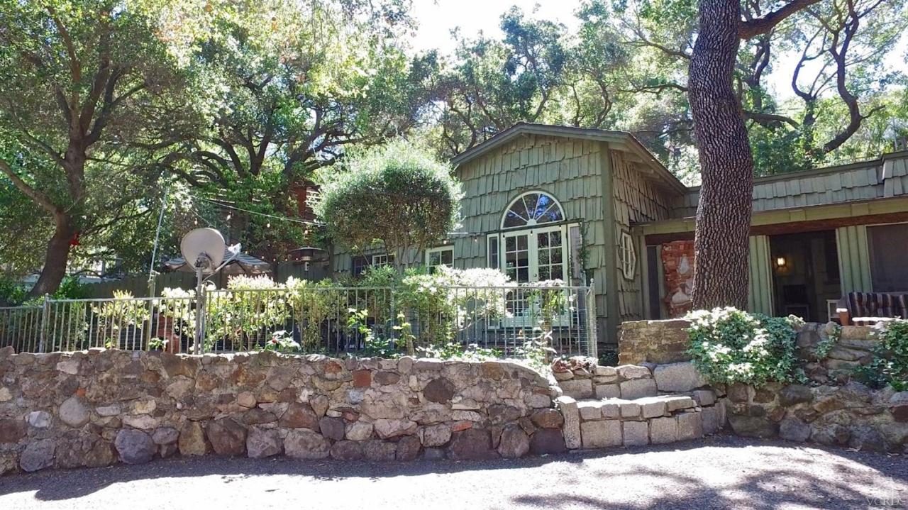 212 Dirt Road Lake Sherwood, CA 91361 - Photo 41 of 41 a front view of a house with garden