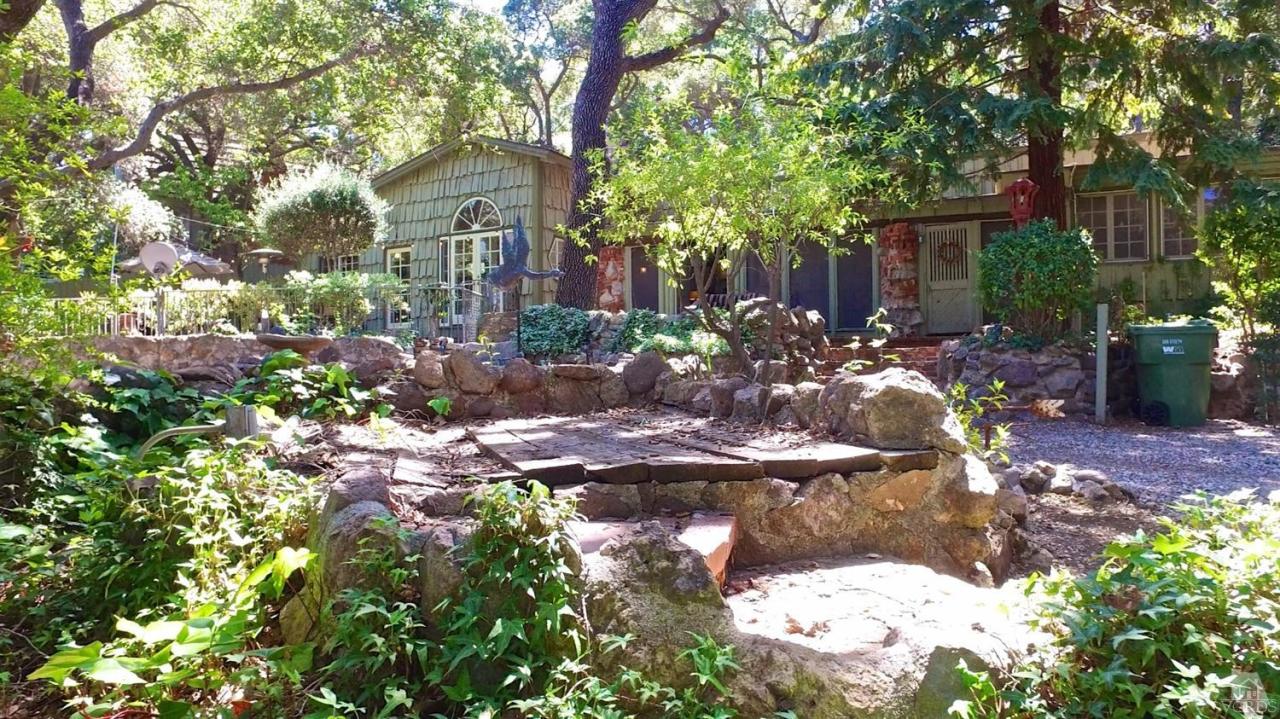 212 Dirt Road Lake Sherwood, CA 91361 - Photo 7 of 41 a view of a house with yard and sitting area