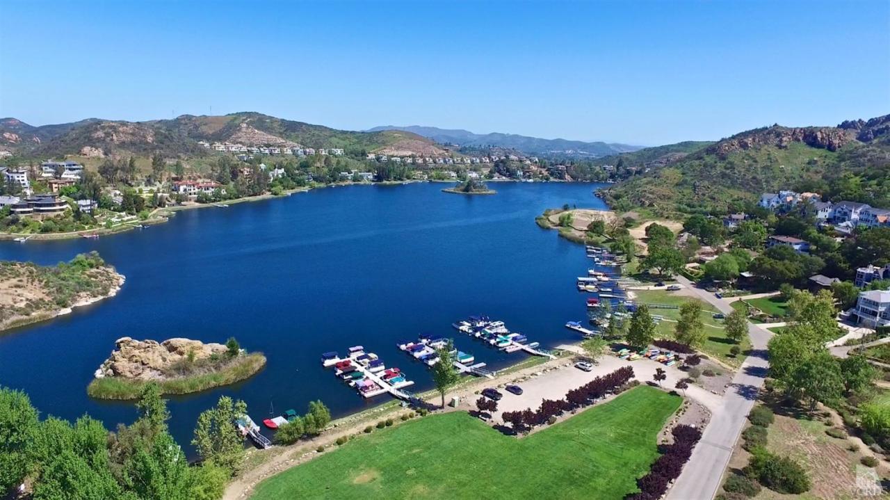 212 Dirt Road Lake Sherwood, CA 91361 - Photo 9 of 41 a view of a lake with a mountain in the background
