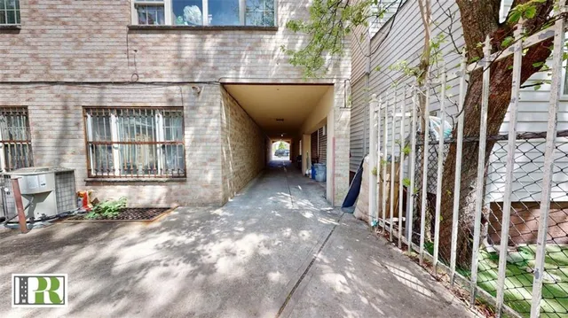 a view of a brick house with many windows