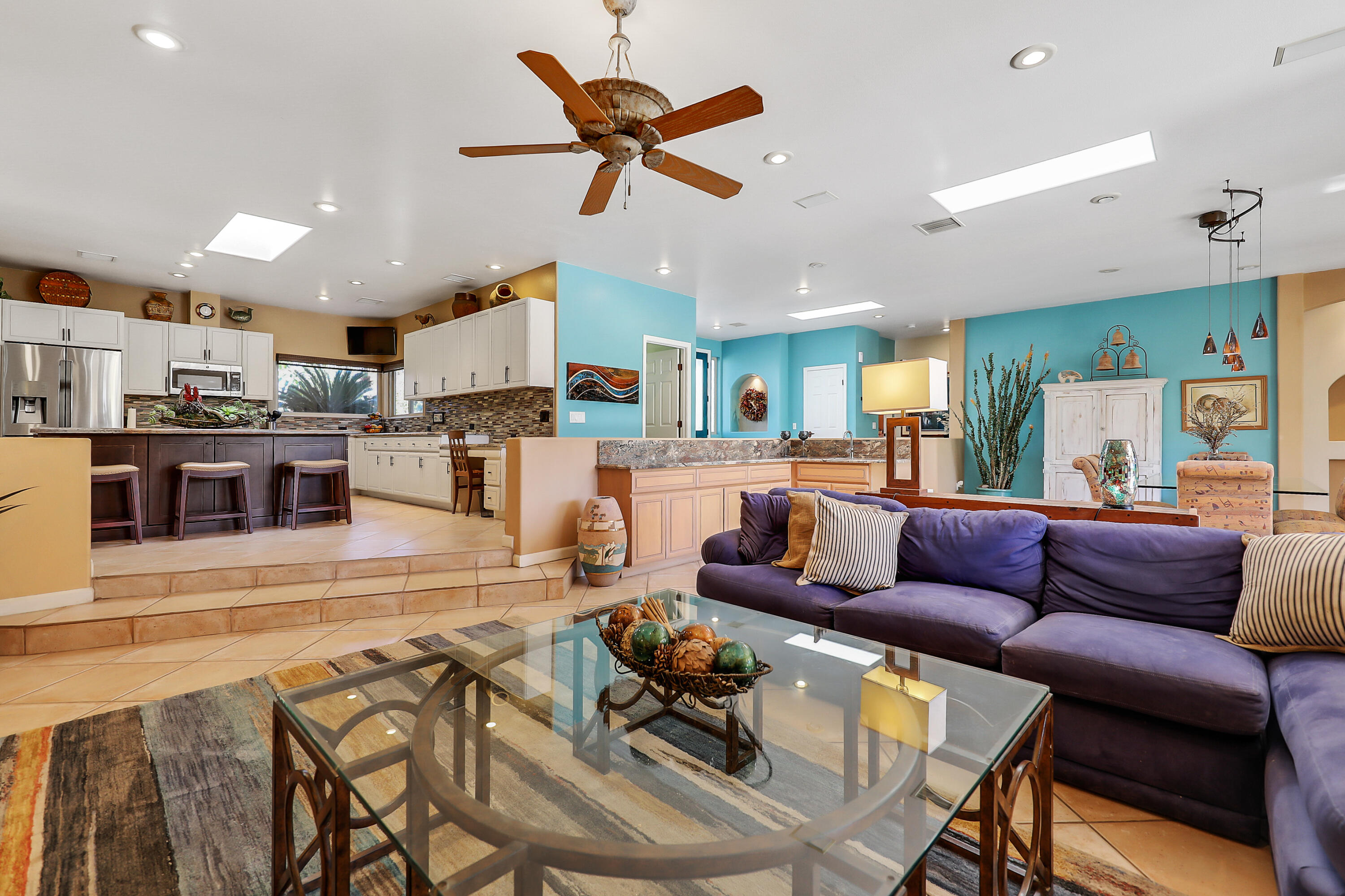 72447 Magnesia Falls Drive Rancho Mirage, CA 92270 - Photo 12 of 50 a living room with furniture kitchen view and a wooden floor