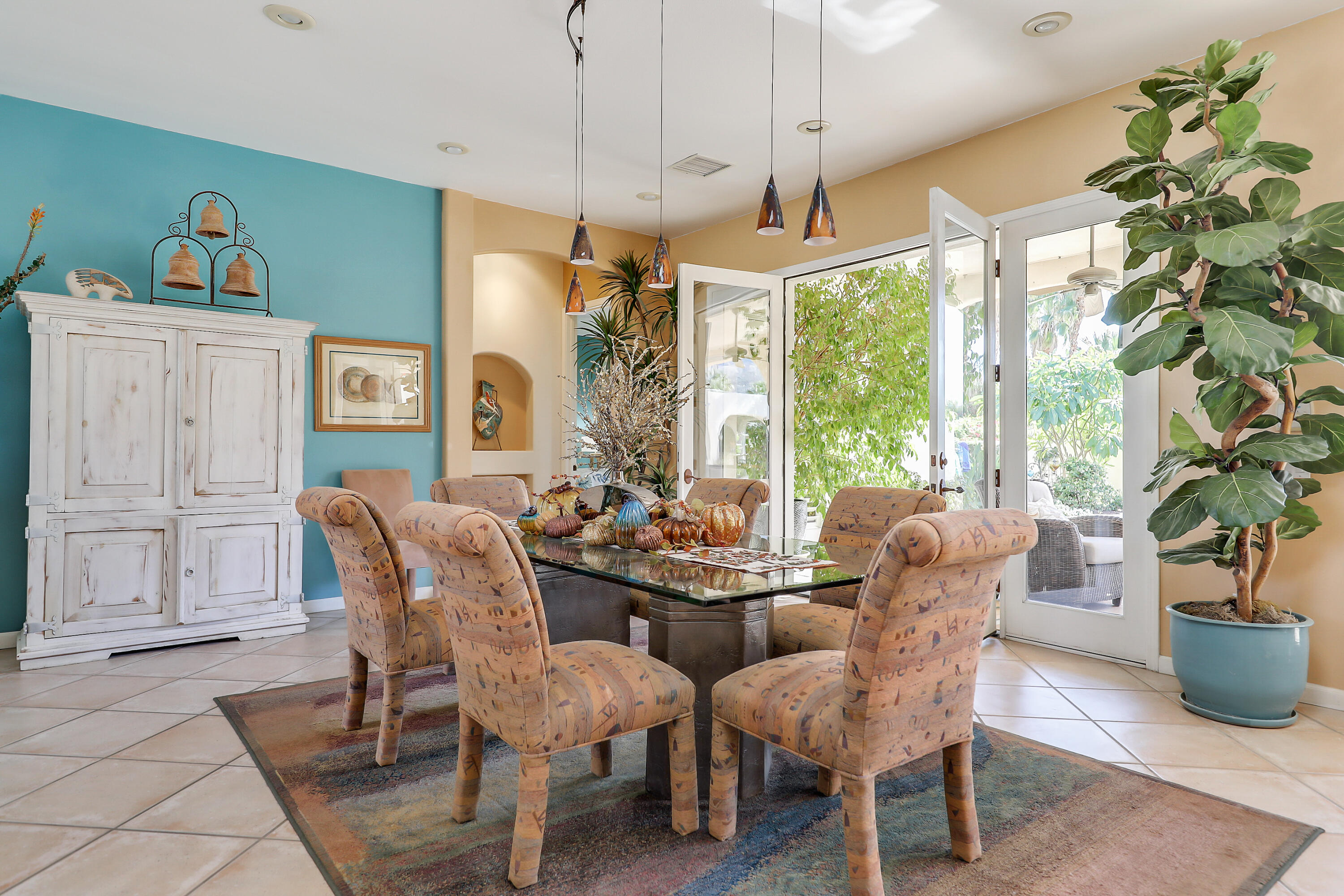72447 Magnesia Falls Drive Rancho Mirage, CA 92270 - Photo 13 of 50 a view of a dining room with furniture window and outside view