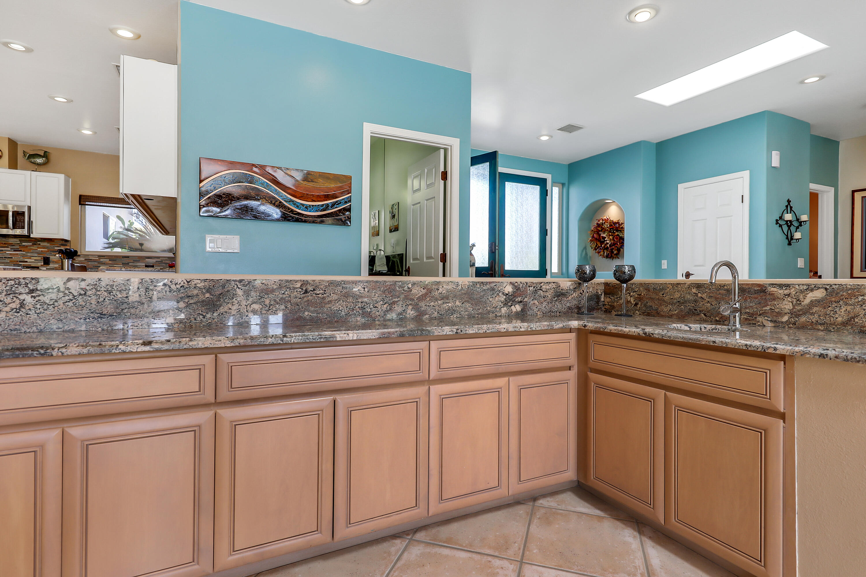 72447 Magnesia Falls Drive Rancho Mirage, CA 92270 - Photo 14 of 50 a kitchen with cabinets and sink