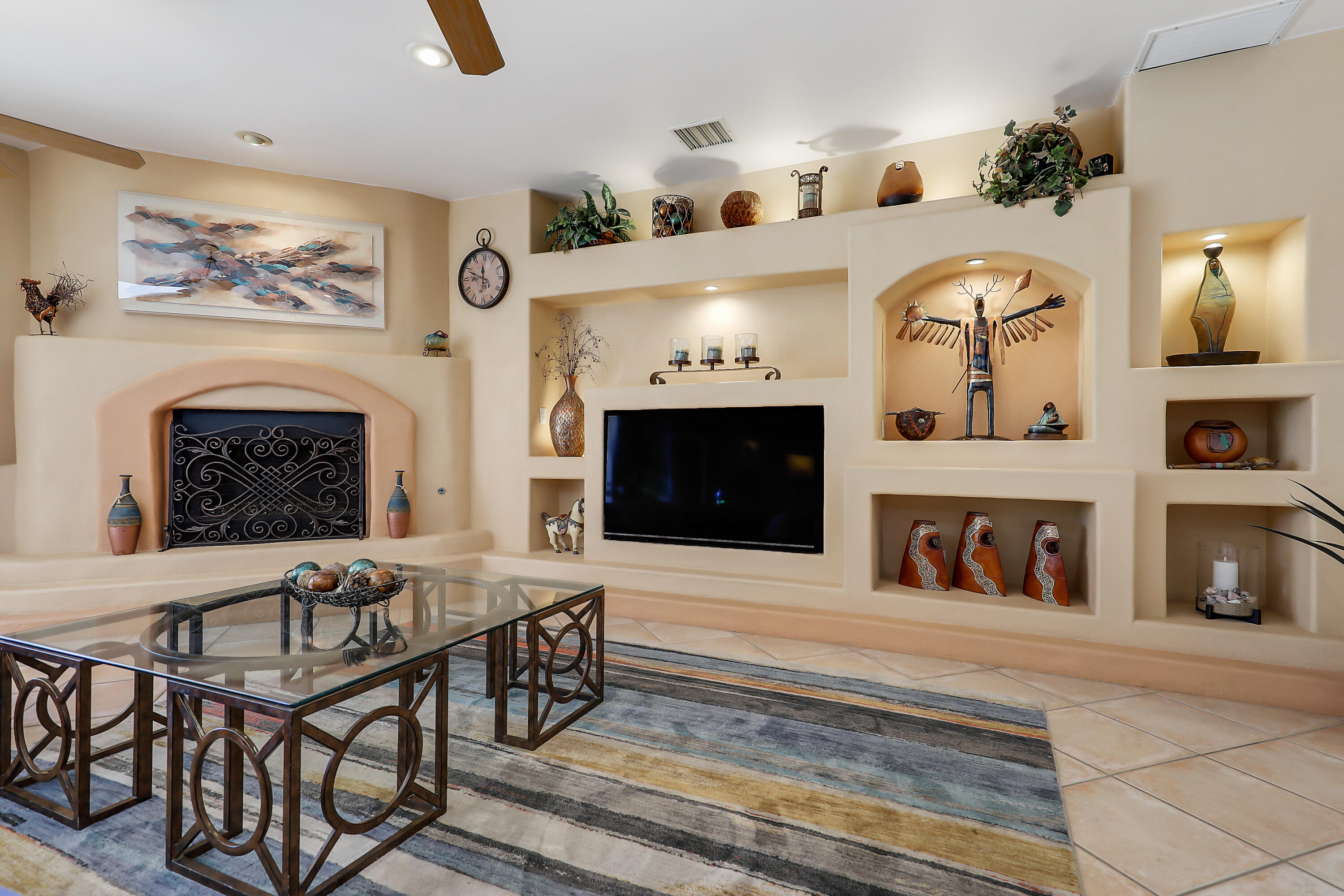72447 Magnesia Falls Drive Rancho Mirage, CA 92270 - Photo 15 of 50 a living room with furniture a fireplace and kitchen view