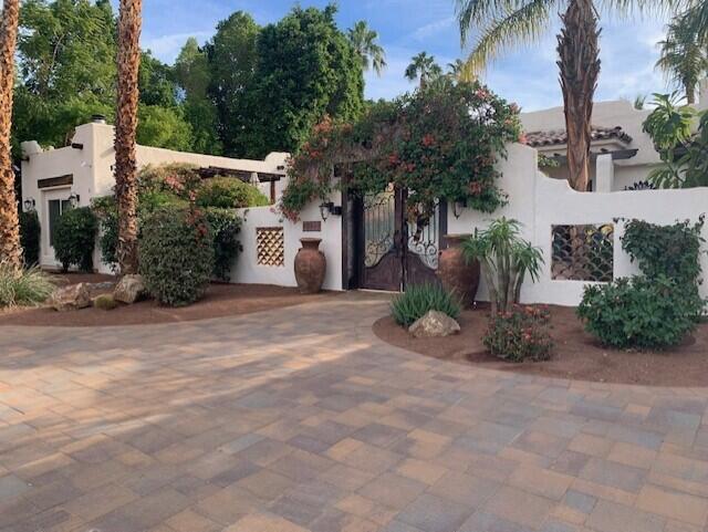 72447 Magnesia Falls Drive Rancho Mirage, CA 92270 - Photo 2 of 50 a view of a street with a building in the background