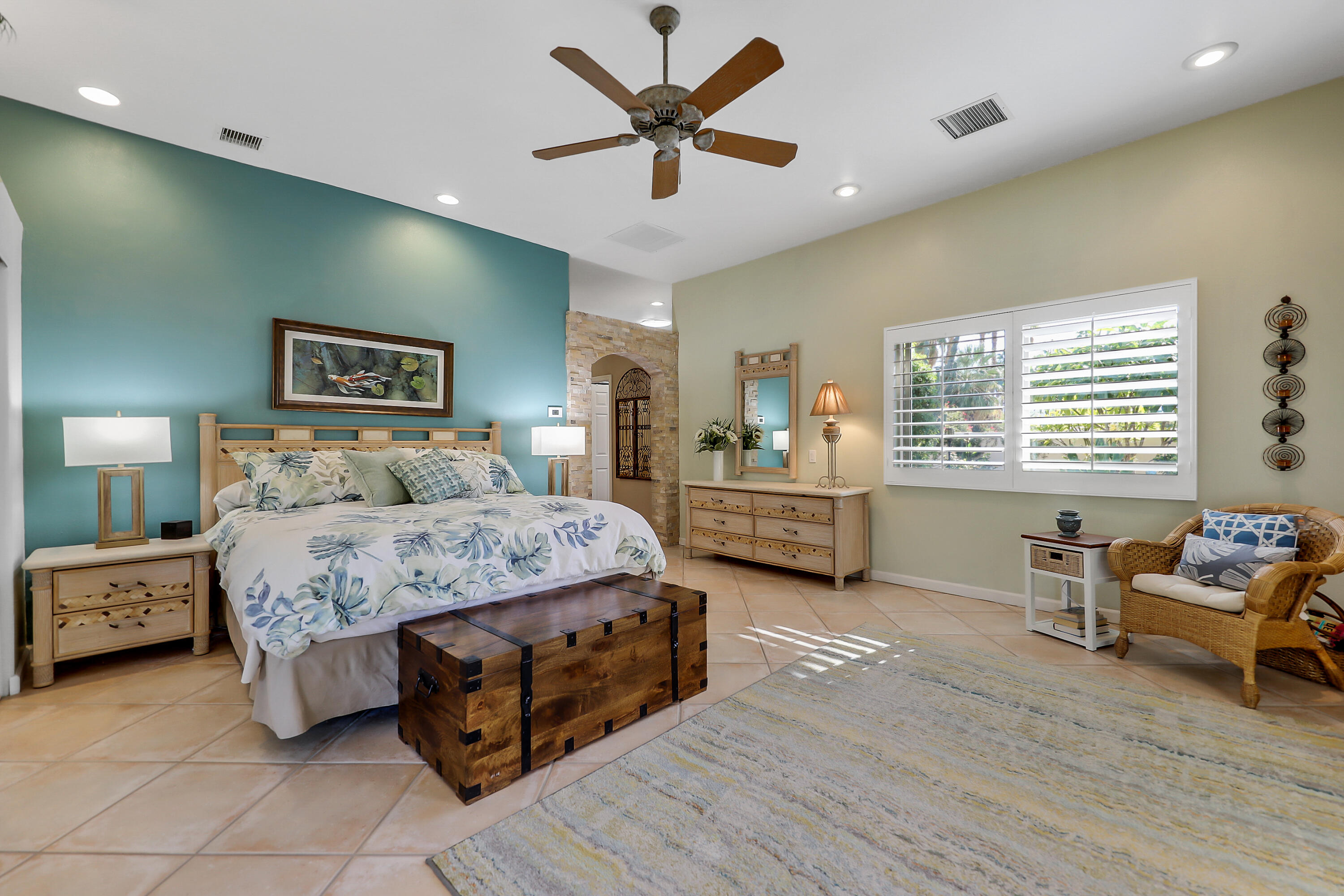 72447 Magnesia Falls Drive Rancho Mirage, CA 92270 - Photo 21 of 50 a bedroom with a bed and a couch
