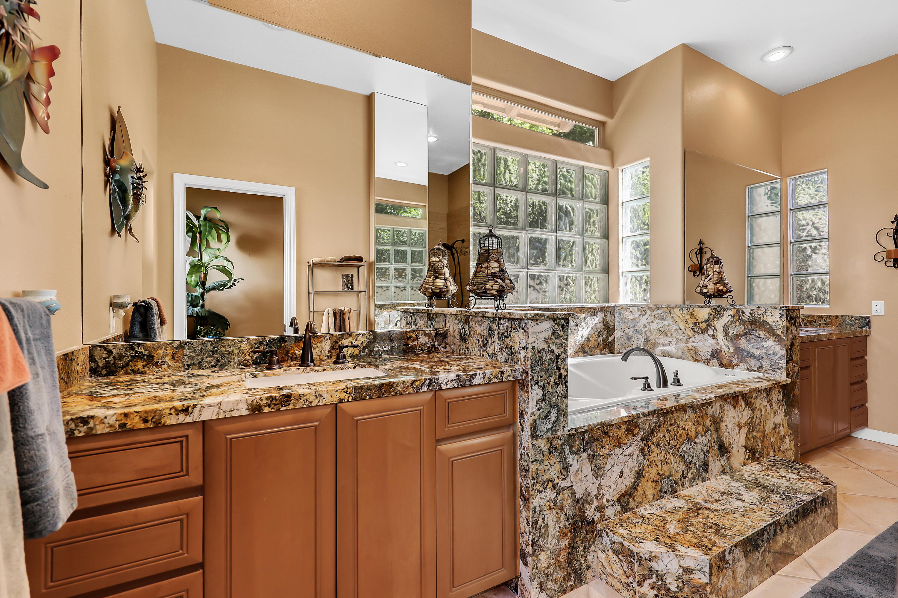 72447 Magnesia Falls Drive Rancho Mirage, CA 92270 - Photo 25 of 50 a living room with stainless steel appliances granite countertop furniture and a large window