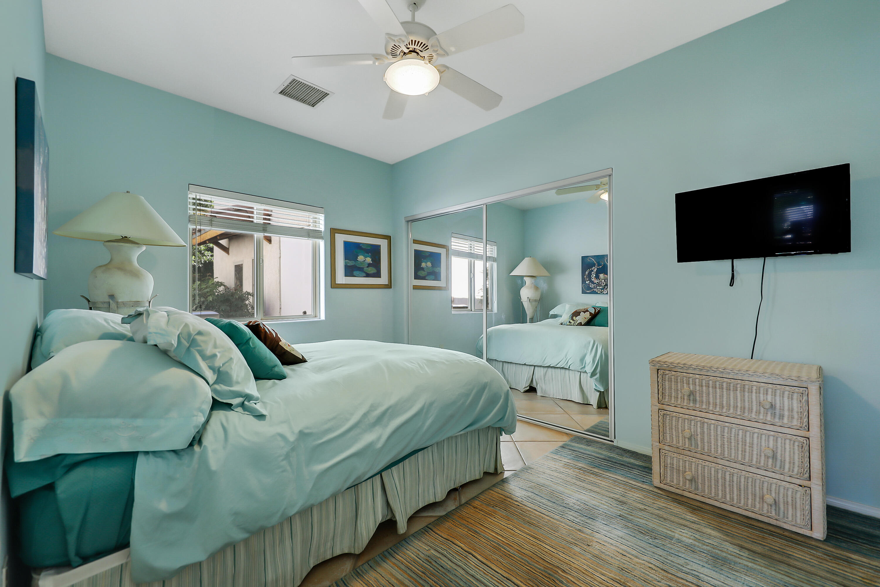 72447 Magnesia Falls Drive Rancho Mirage, CA 92270 - Photo 28 of 50 a bedroom with a bed and a flat screen tv