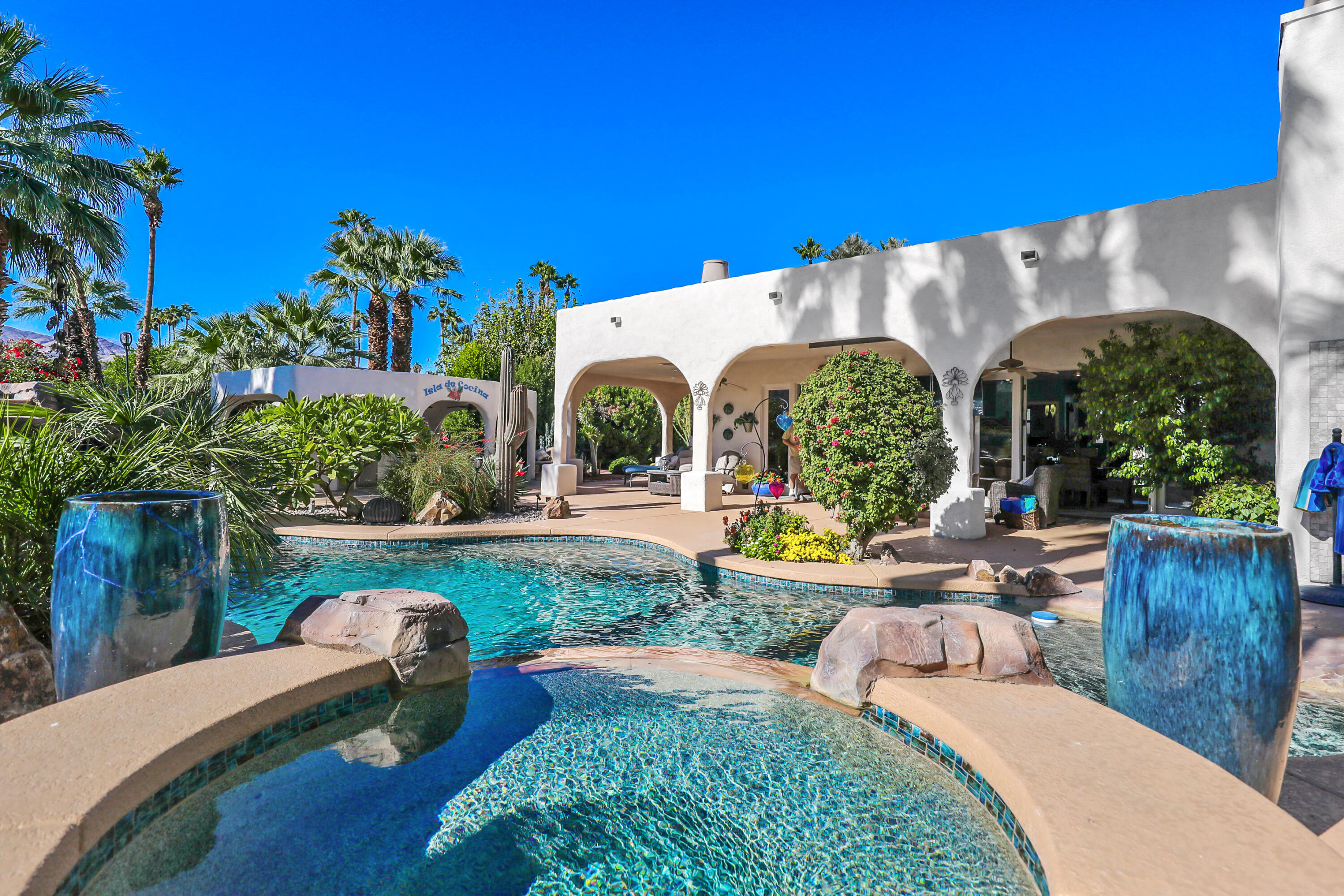 72447 Magnesia Falls Drive Rancho Mirage, CA 92270 - Photo 39 of 50 a view of a backyard with plants and outdoor seating