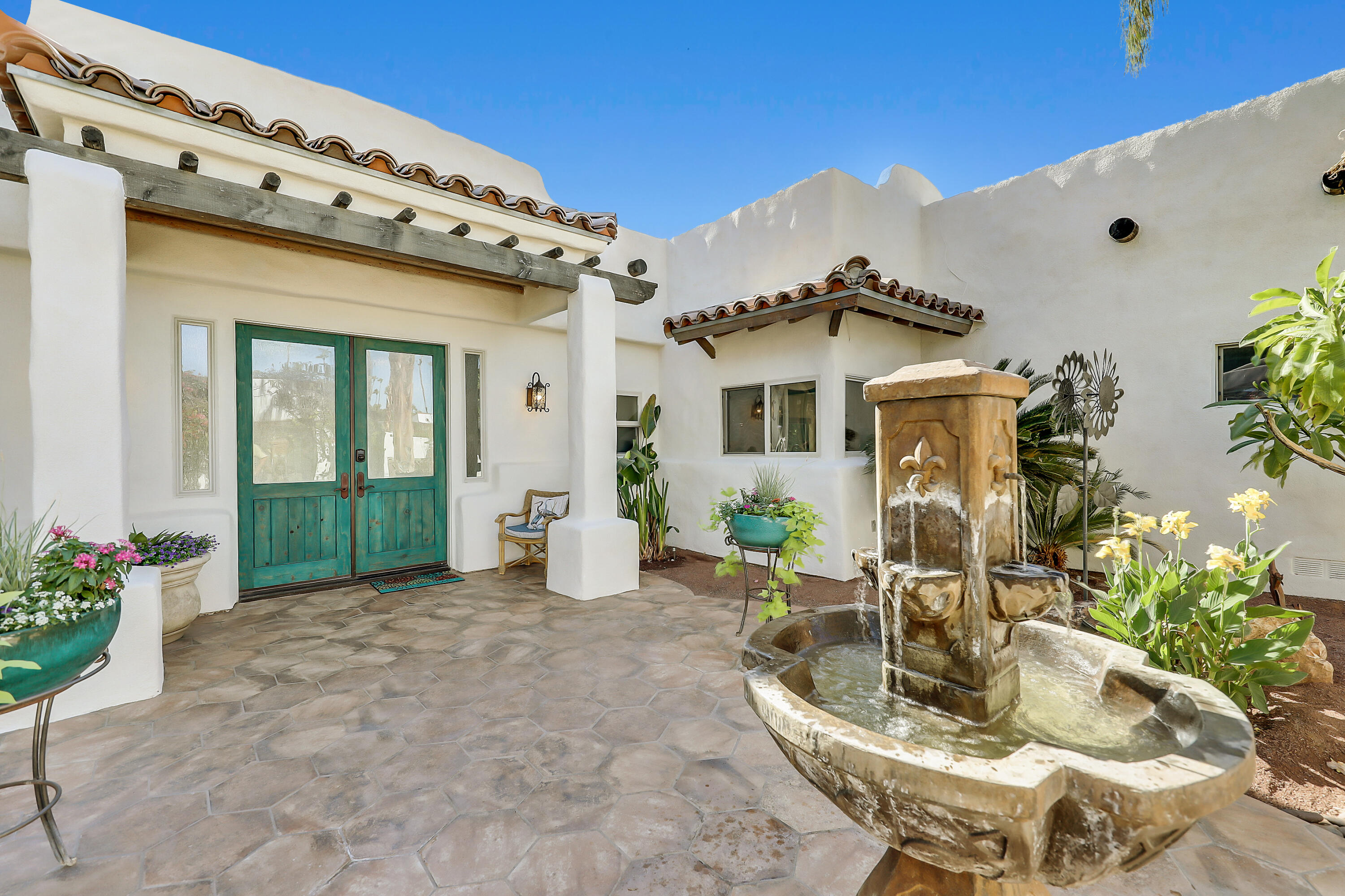 72447 Magnesia Falls Drive Rancho Mirage, CA 92270 - Photo 4 of 50 a house view with a outdoor space