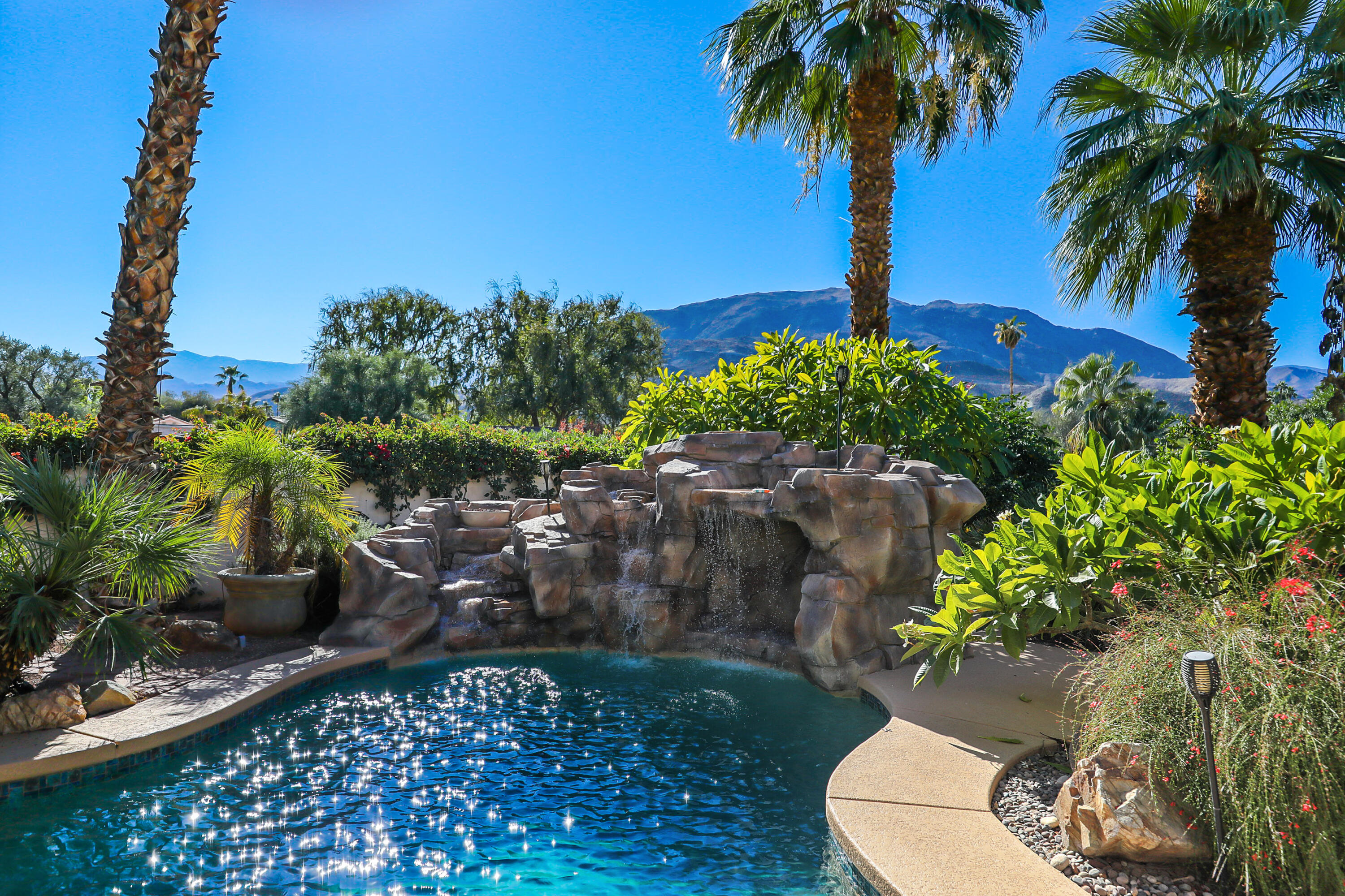 72447 Magnesia Falls Drive Rancho Mirage, CA 92270 - Photo 41 of 50 a house view with a garden space