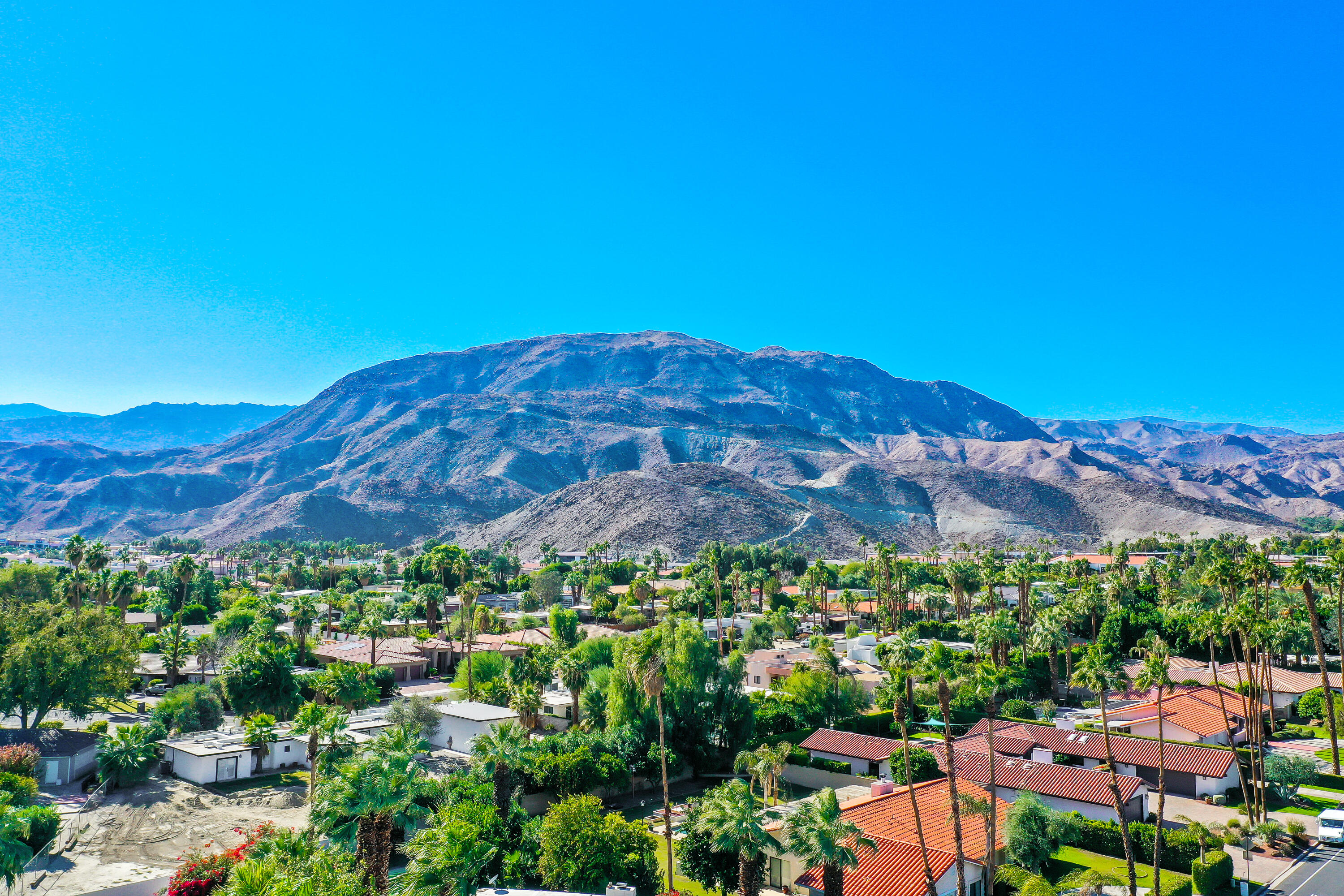 72447 Magnesia Falls Drive Rancho Mirage, CA 92270 - Photo 48 of 50 a view of a city with a mountain