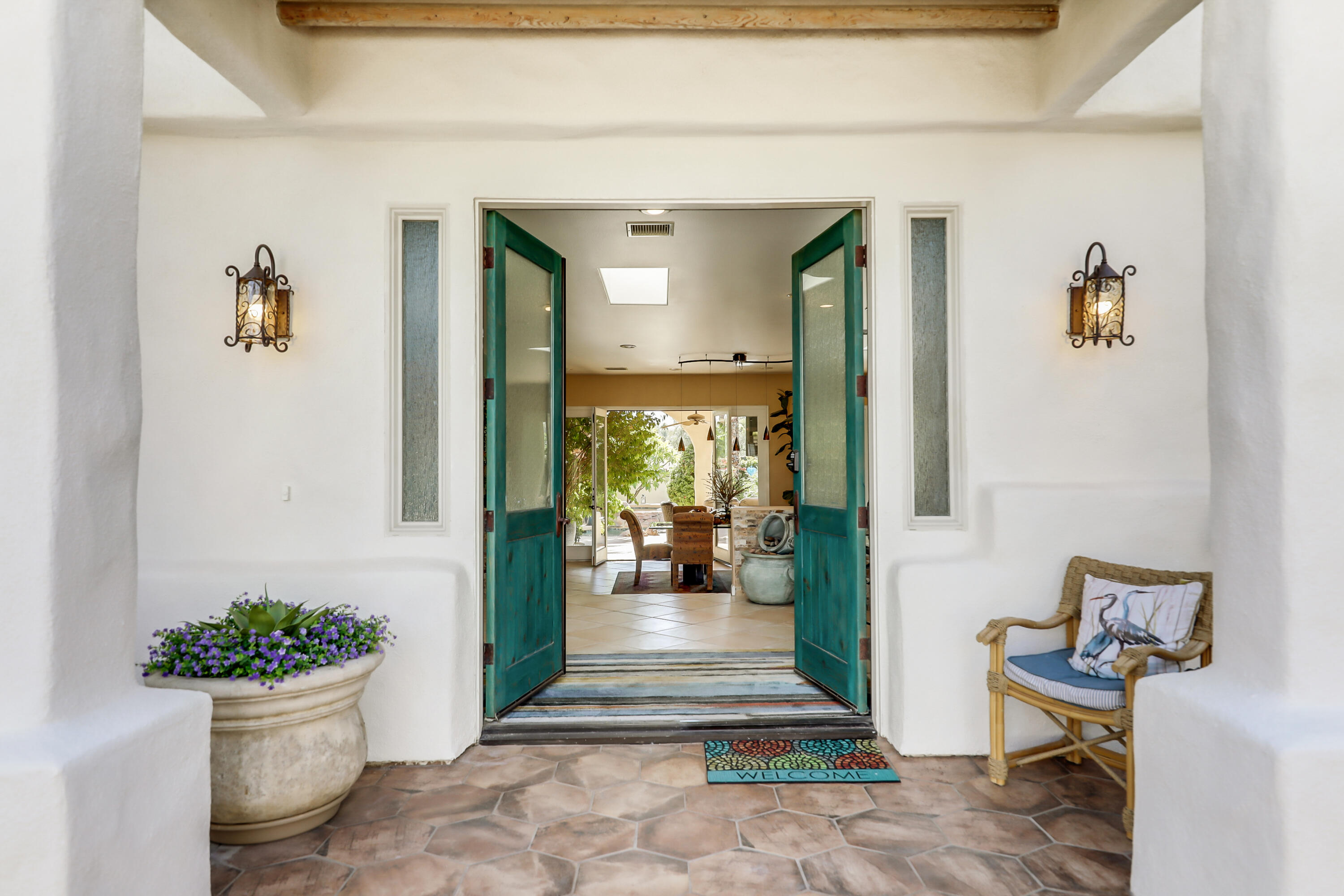 72447 Magnesia Falls Drive Rancho Mirage, CA 92270 - Photo 6 of 50 a view of an entryway with wooden floor and a potted plant