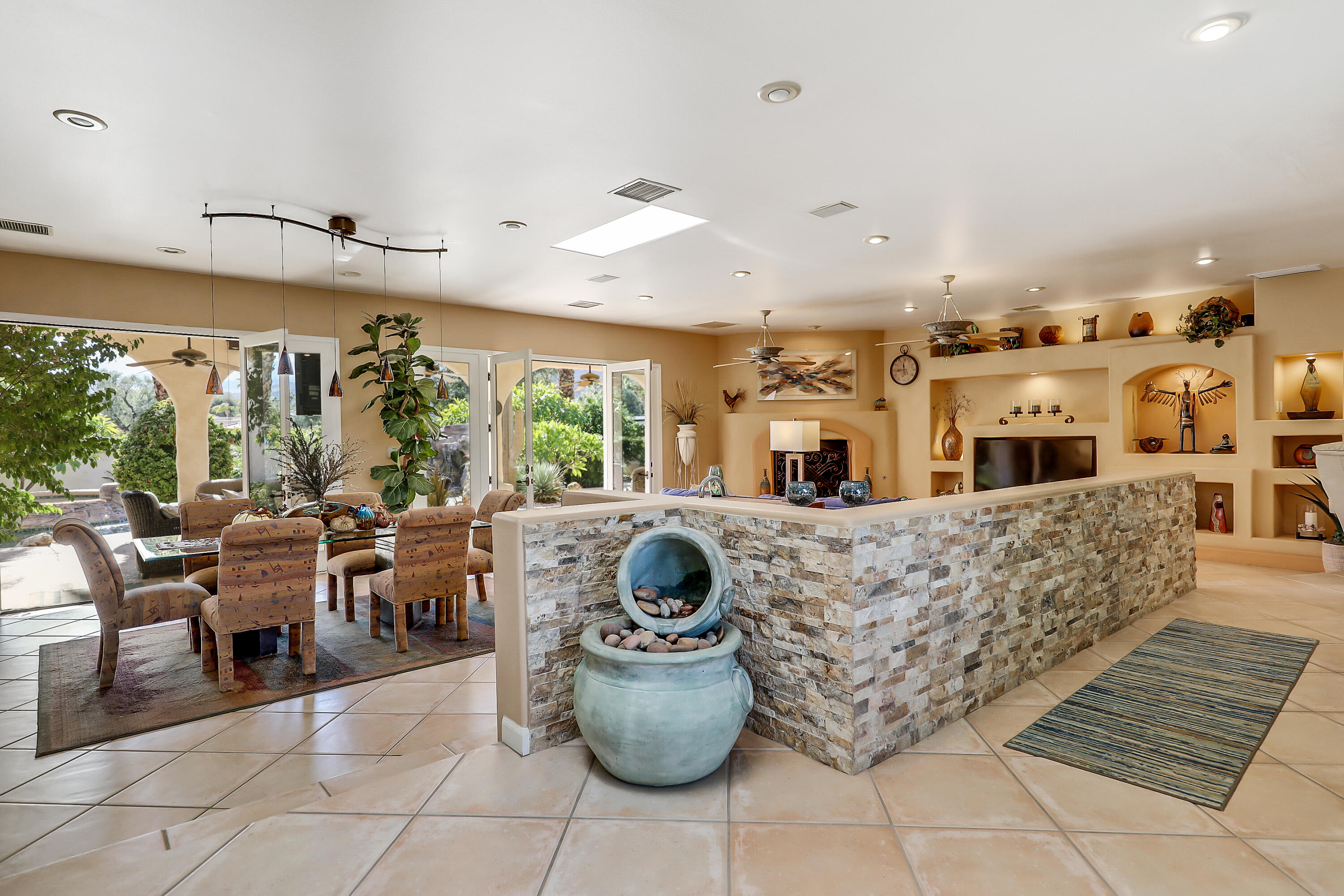 72447 Magnesia Falls Drive Rancho Mirage, CA 92270 - Photo 8 of 50 a living room with furniture and a floor to ceiling window