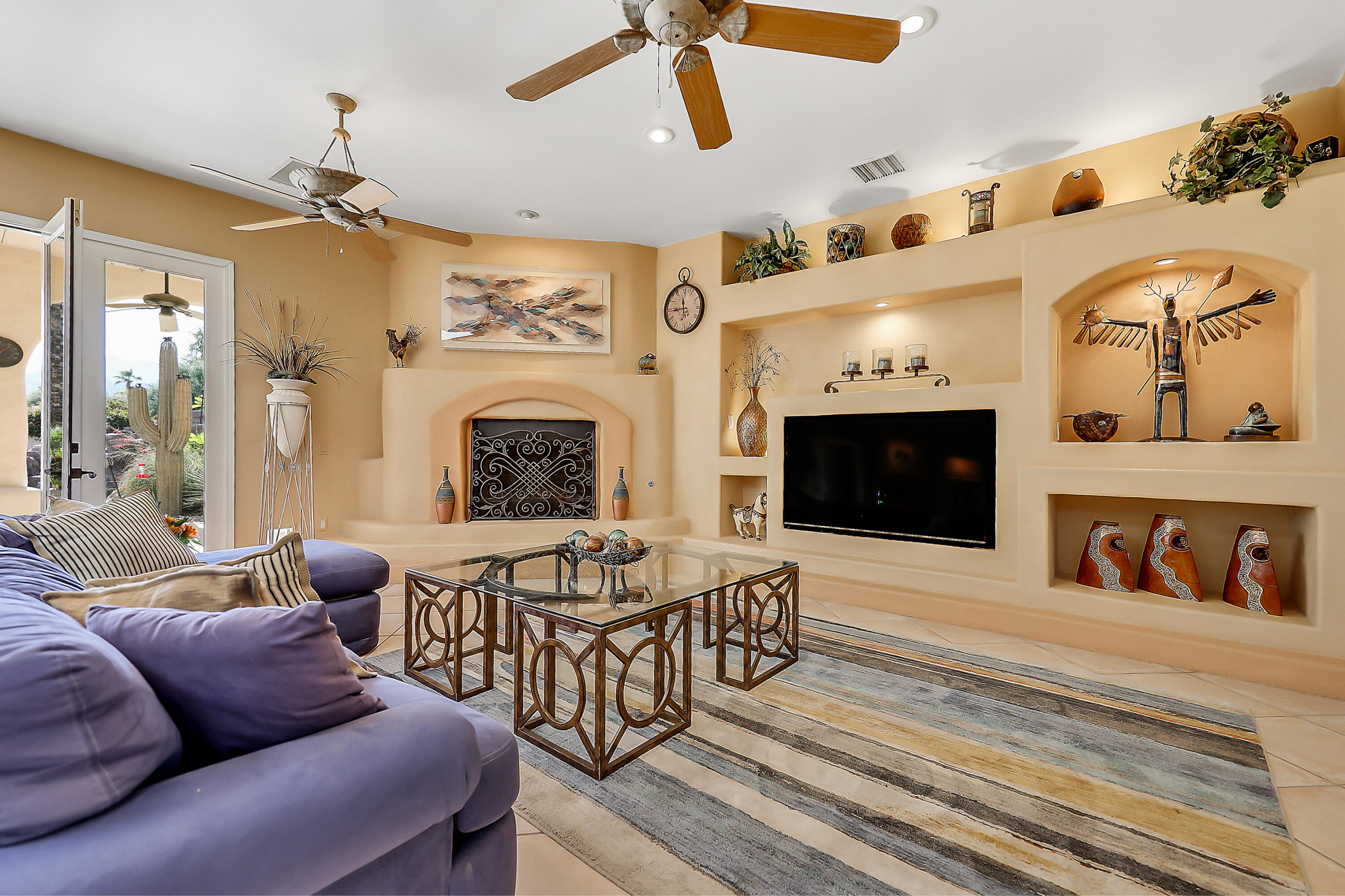 72447 Magnesia Falls Drive Rancho Mirage, CA 92270 - Photo 10 of 50 a living room with furniture fireplace and flat screen tv