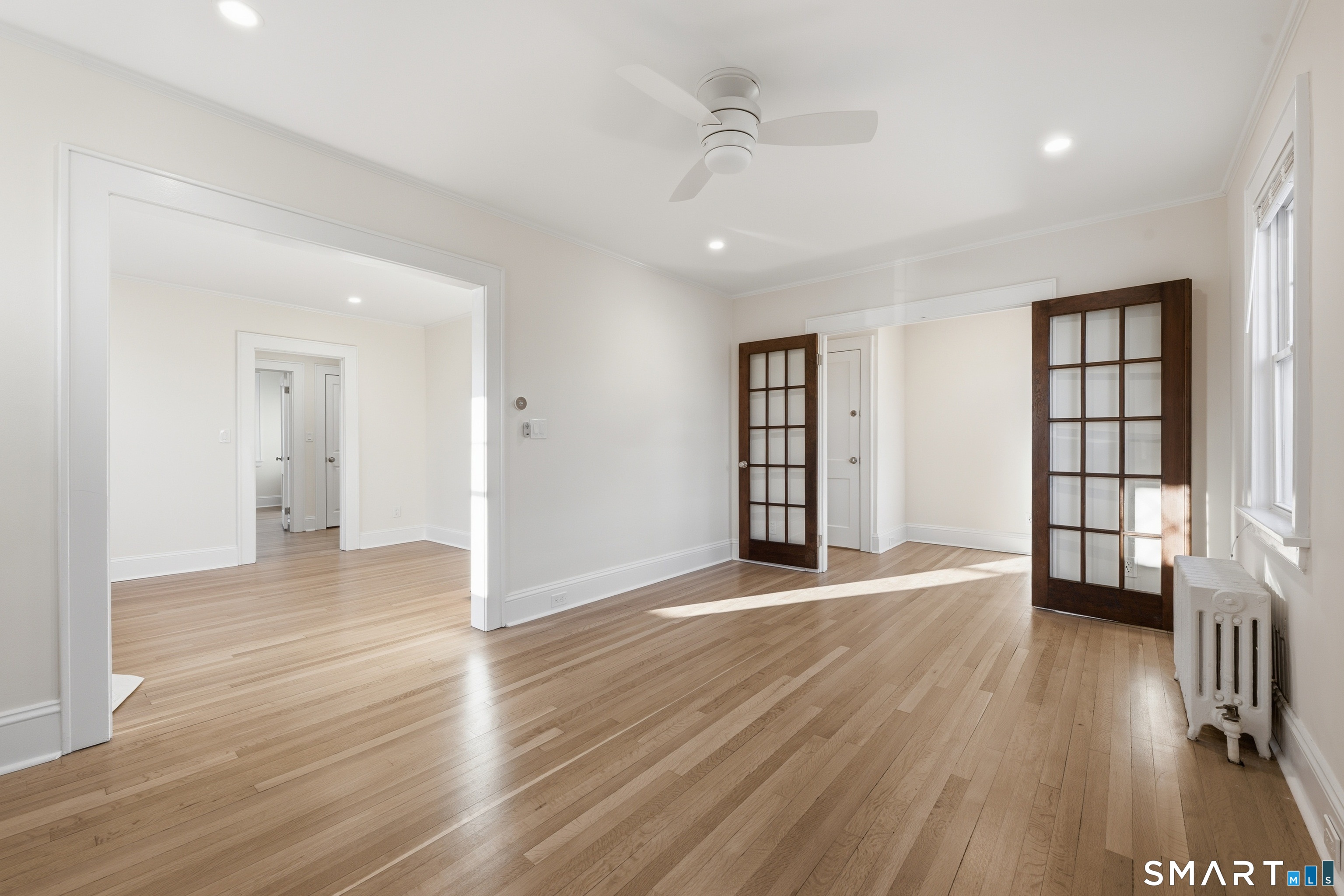 44 Lorraine Terrace, Unit 2 Bridgeport, CT 06604 - Photo 1 of 16 wooden floor in an empty room with a window