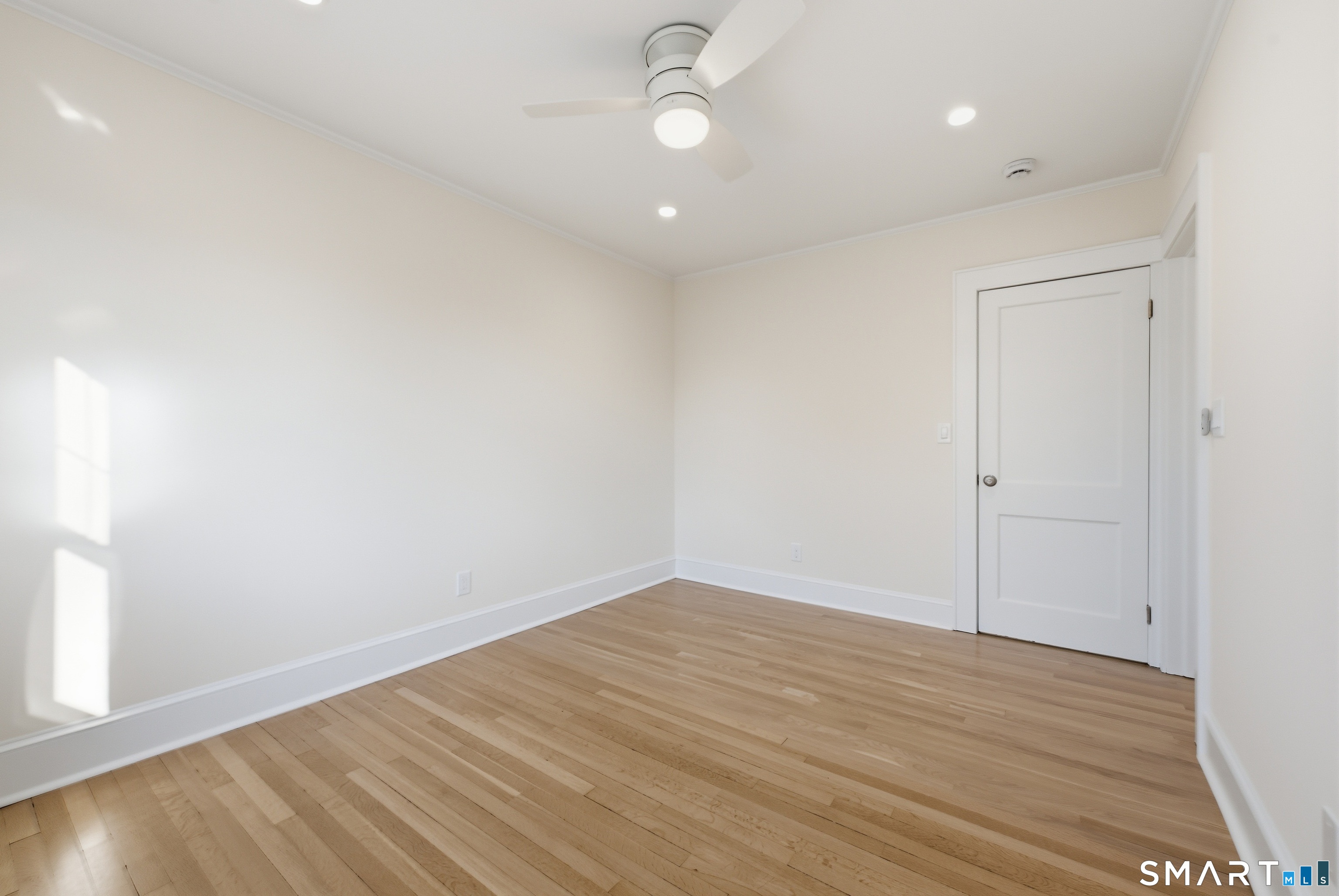 44 Lorraine Terrace, Unit 2 Bridgeport, CT 06604 - Photo 12 of 16 wooden floor in an empty room