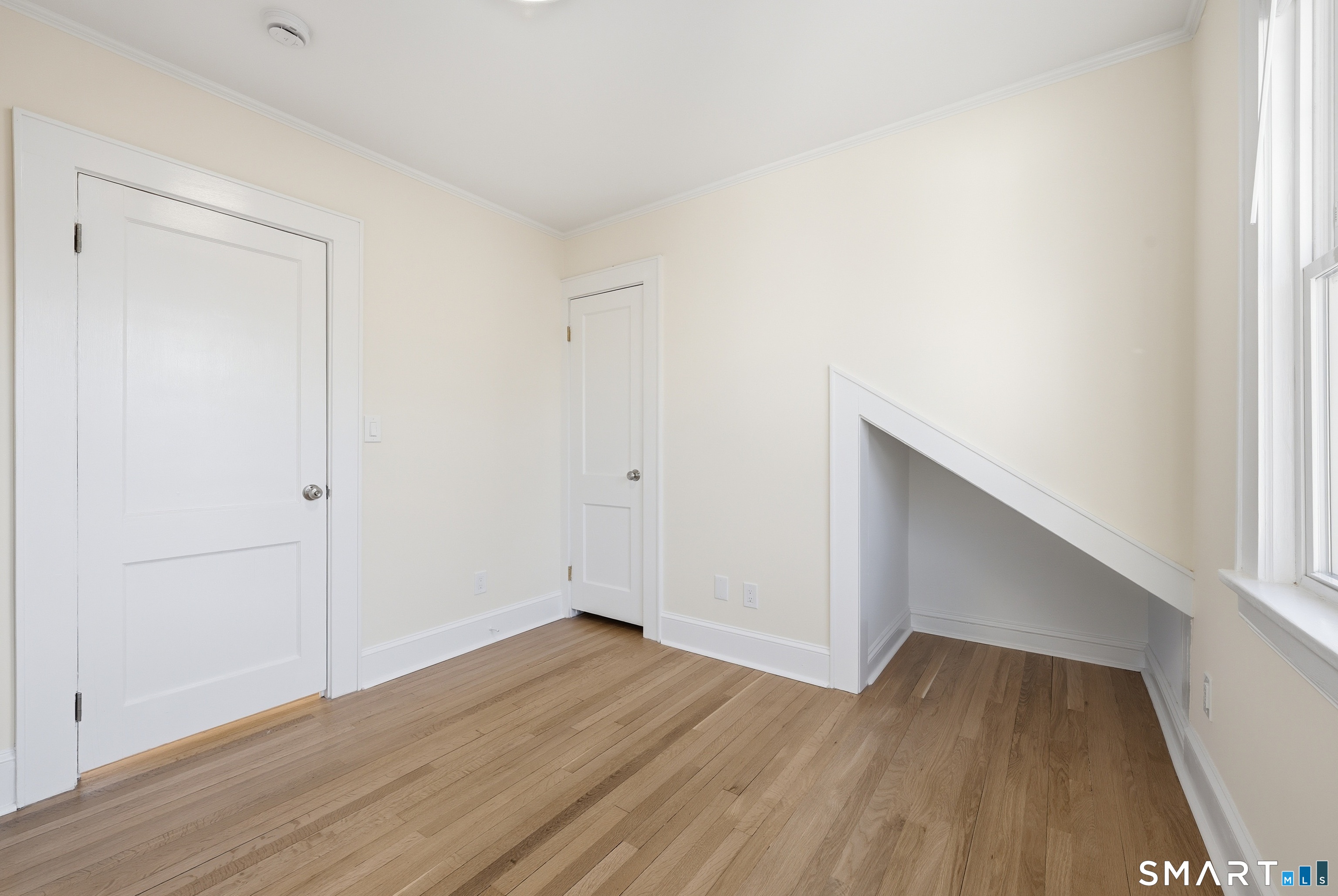 44 Lorraine Terrace, Unit 2 Bridgeport, CT 06604 - Photo 15 of 16 a view of an empty room with wooden floor