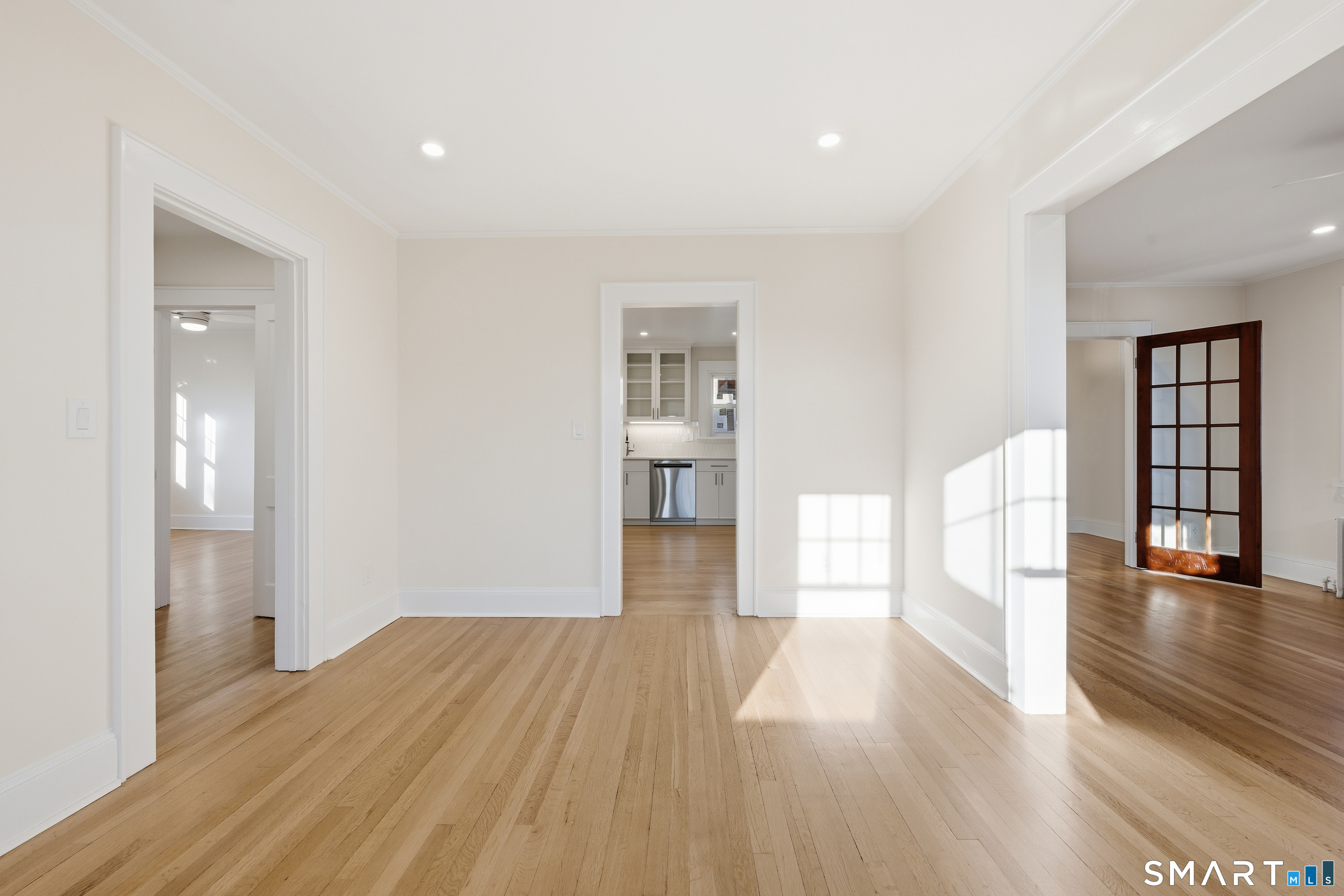 44 Lorraine Terrace, Unit 2 Bridgeport, CT 06604 - Photo 4 of 16 a view of a big room with wooden floor and windows