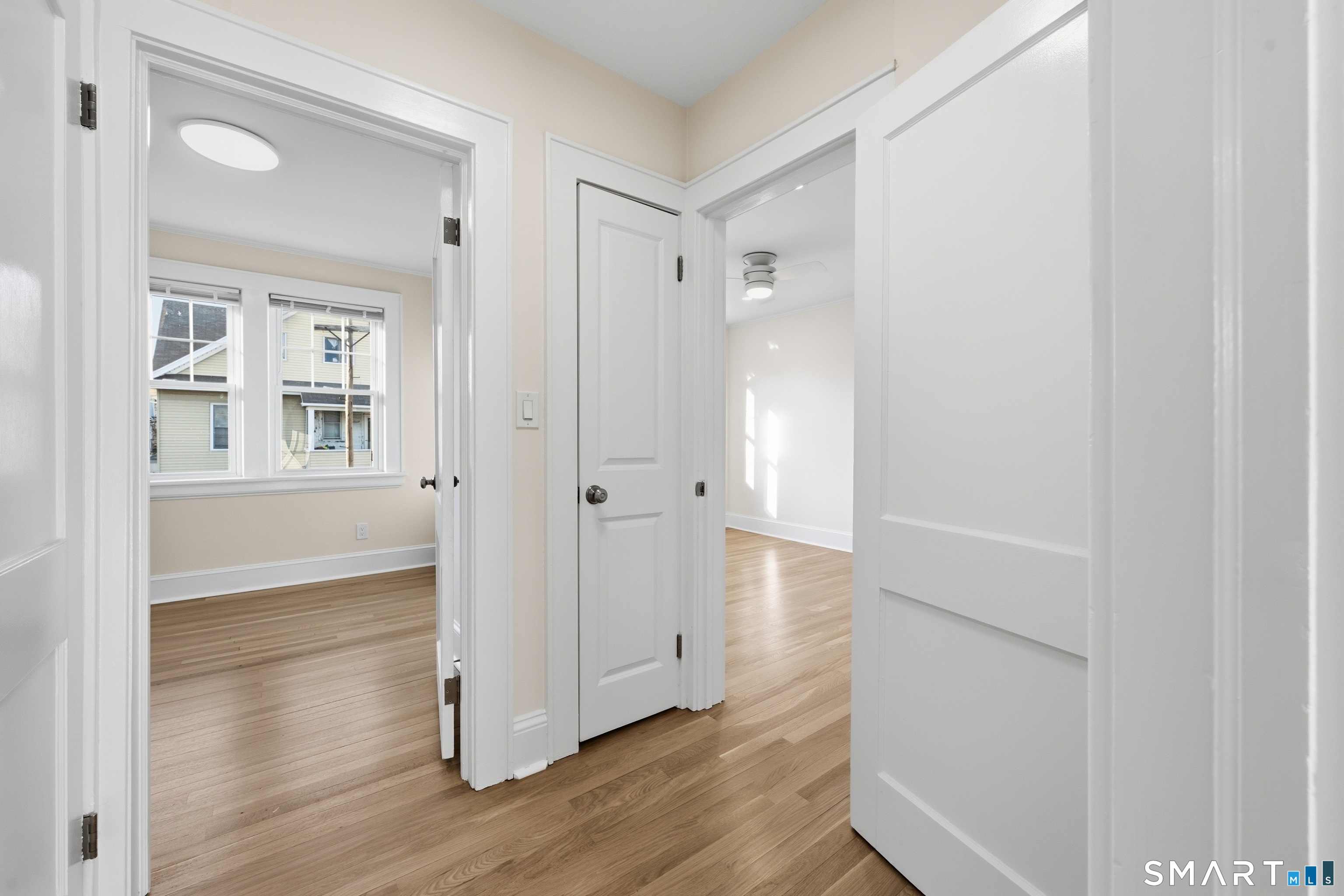 44 Lorraine Terrace, Unit 2 Bridgeport, CT 06604 - Photo 10 of 16 a view of a hallway with wooden floor