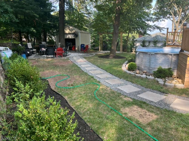 11 Surrey Place, Unit 1 Hawthorne, NJ 07506 - Photo 12 of 13 a view of a house with backyard and sitting area