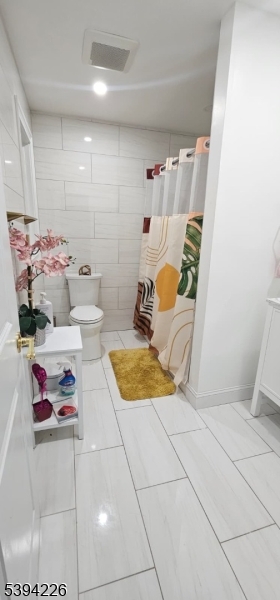 11 Surrey Place, Unit 1 Hawthorne, NJ 07506 - Photo 4 of 13 a bathroom with a tub sink and a mirror