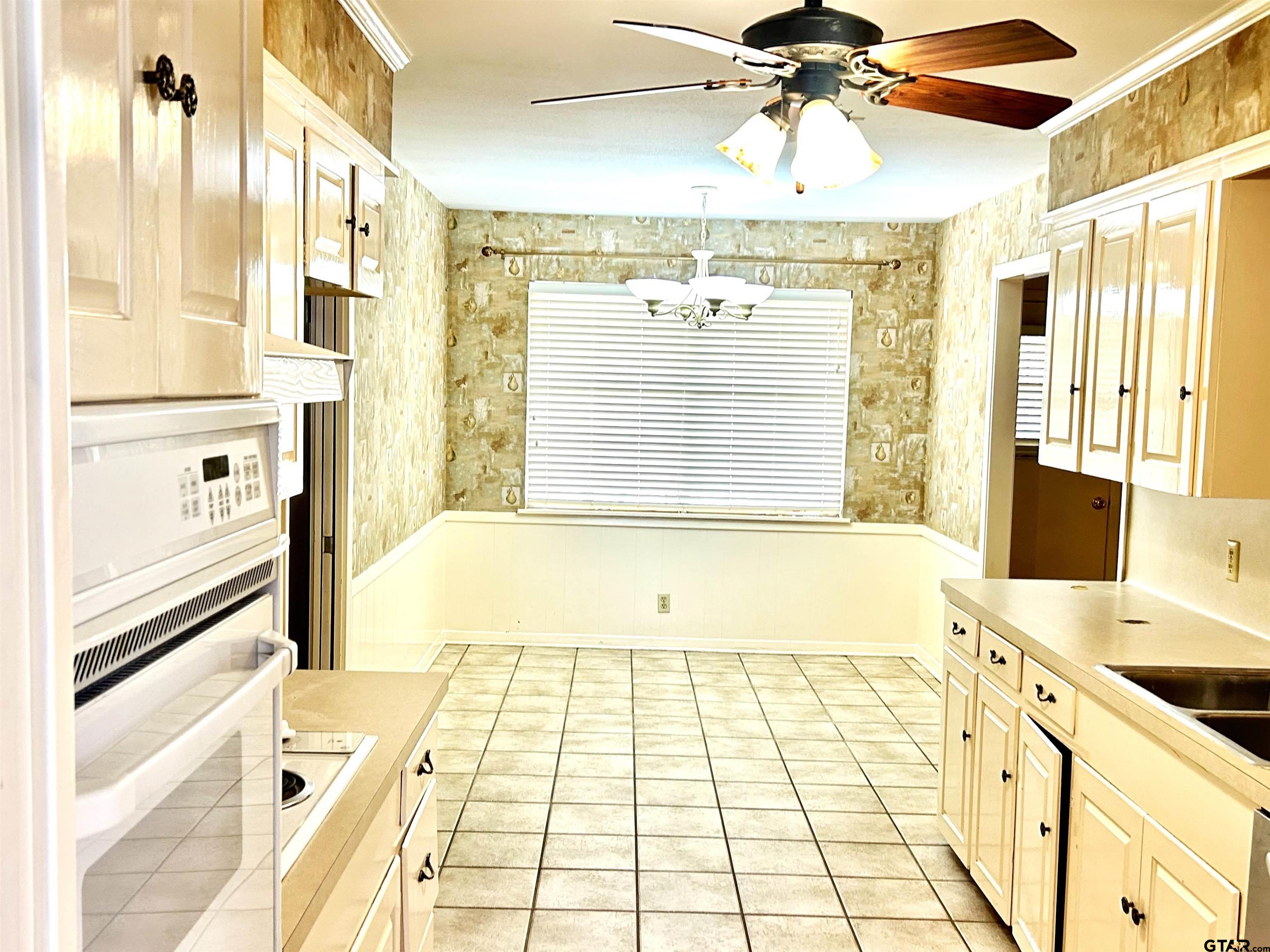 3713 Colgate Avenue Tyler, TX 75701 - Photo 4 of 13 a bathroom with a tub shower and sink