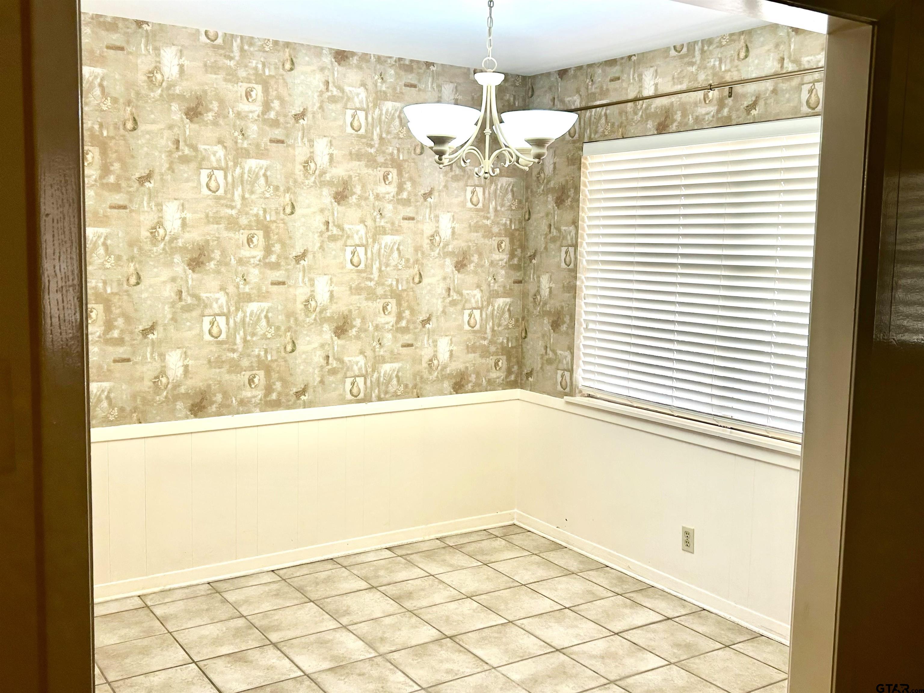 3713 Colgate Avenue Tyler, TX 75701 - Photo 5 of 13 a bathroom with a bathtub and shower