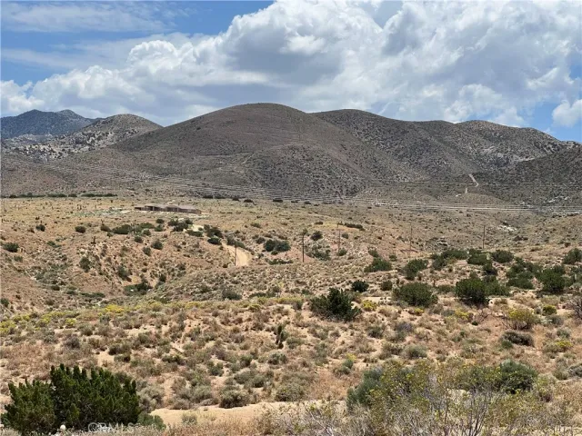 a view of mountain with sunset view