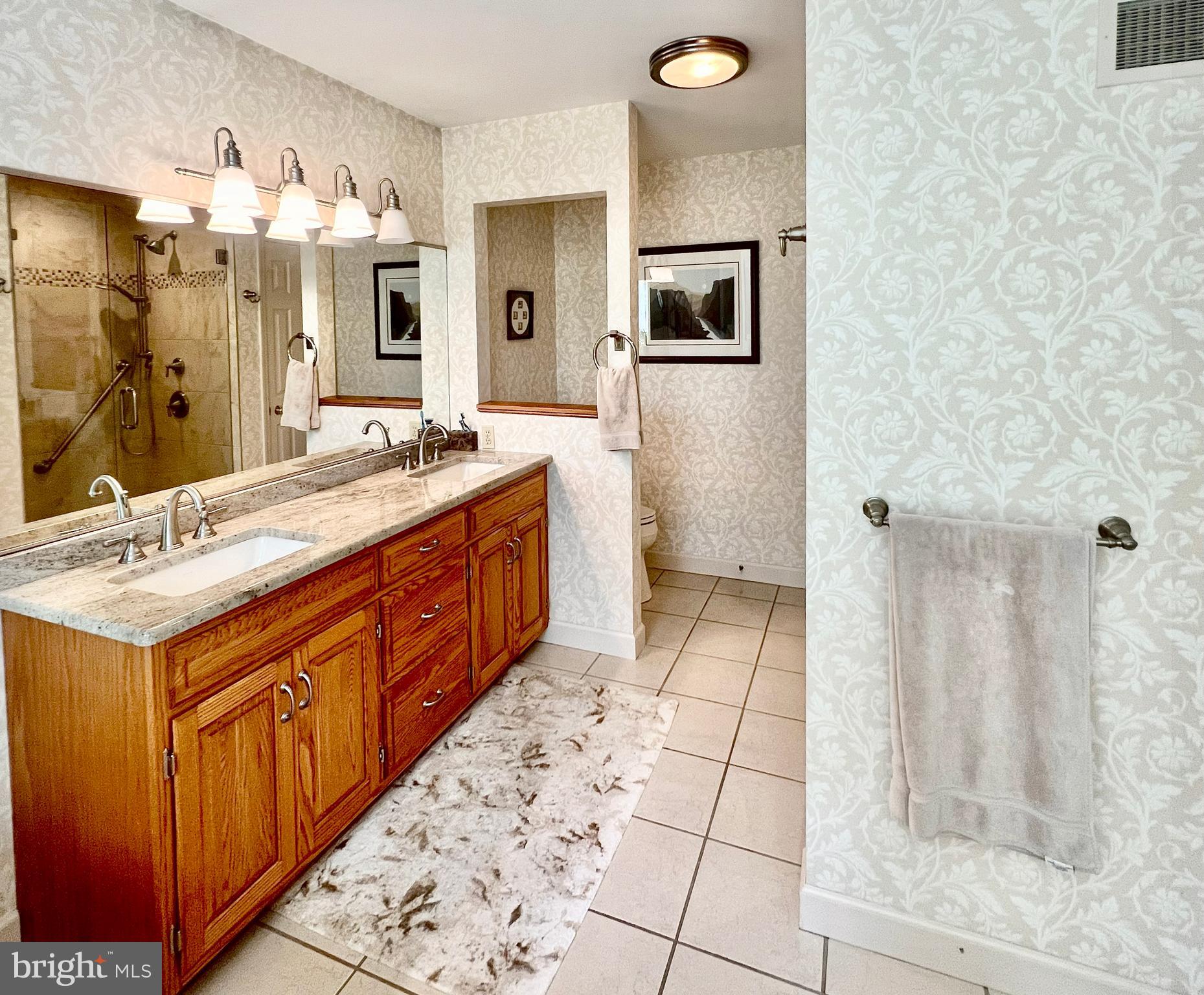 3 Royal Court Reading, PA 19607 - Photo 26 of 39 a spacious bathroom with a double vanity sink a mirror and a shower