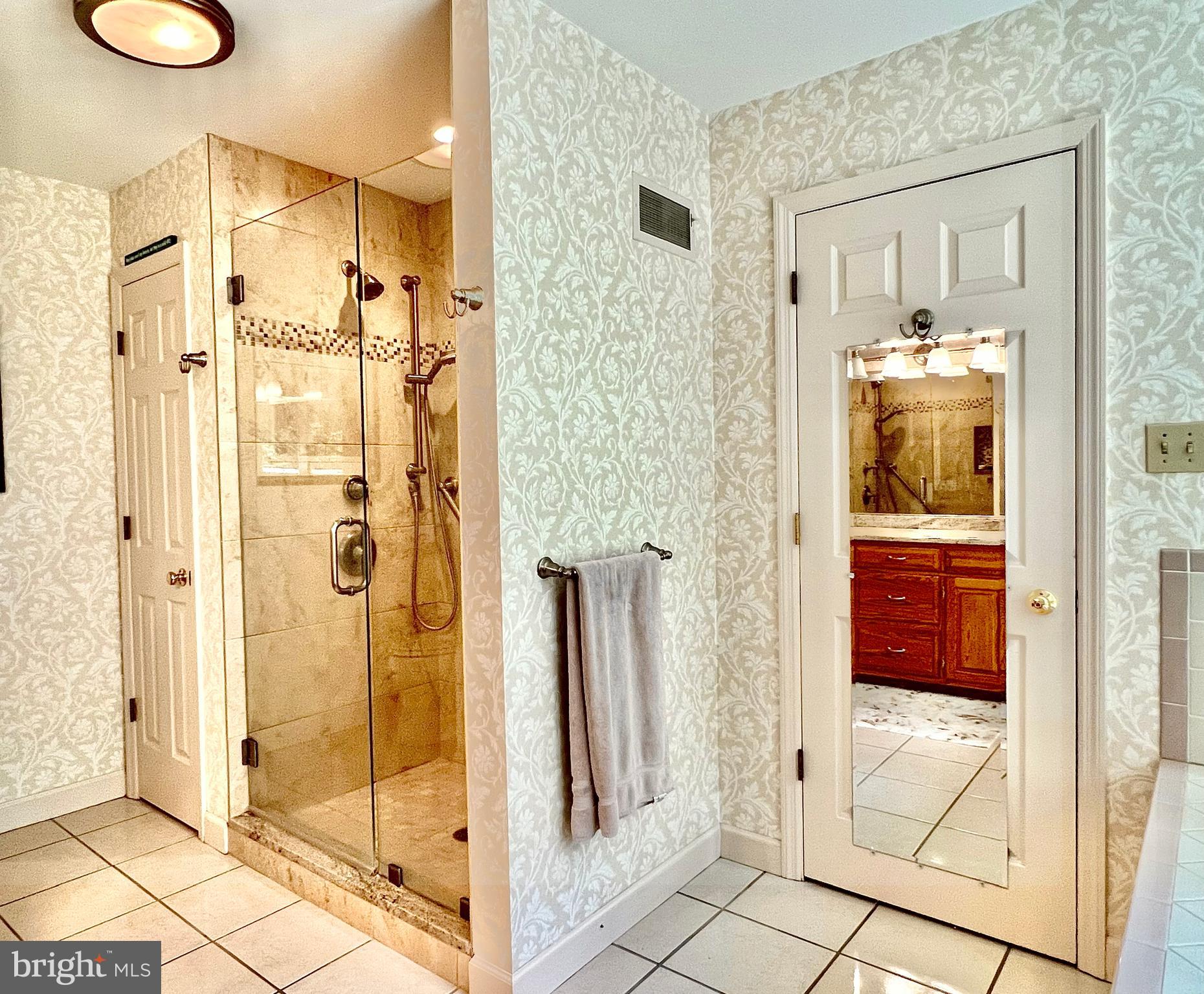 3 Royal Court Reading, PA 19607 - Photo 27 of 39 a bathroom with a granite countertop shower mirror and a sink