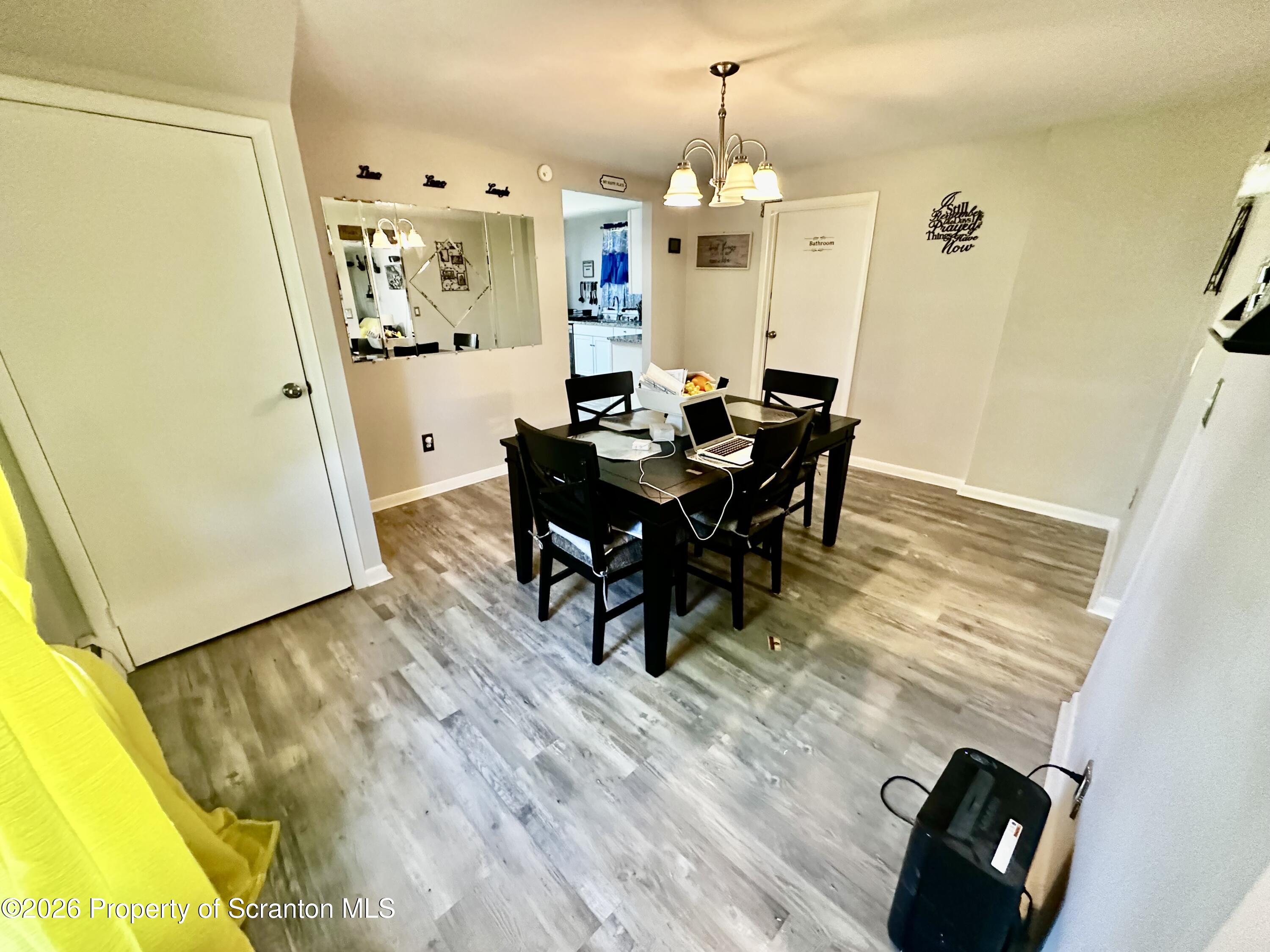 1727 Bulwer Street Scranton, PA 18504 - Photo 26 of 40 a view of a dining room with furniture and wooden floor