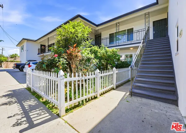 a view of a house with wooden floor and a porch