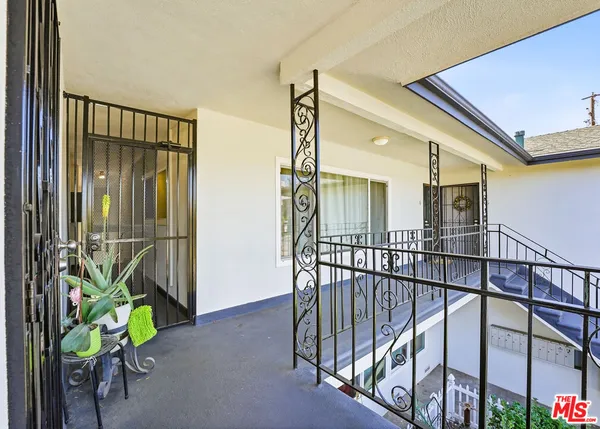 a view of an entryway with a potted plant