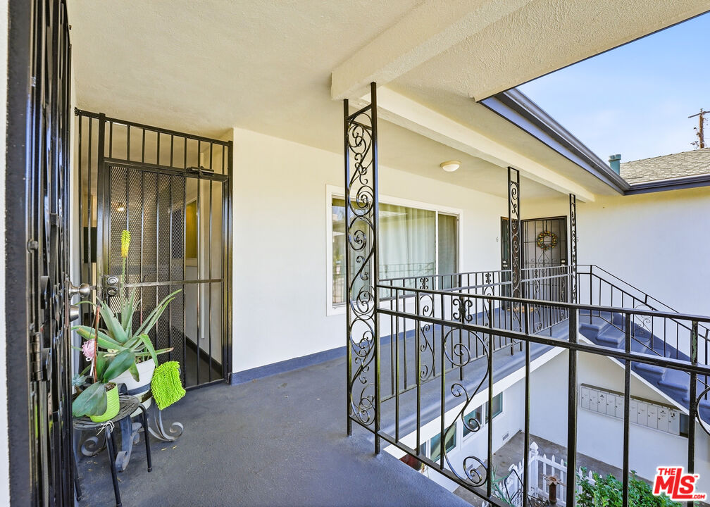 1027 North Parton Street Santa Ana, CA 92701 - Photo 5 of 7 a view of an entryway with a potted plant