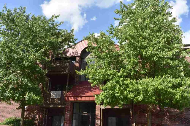 a view of a house with a tree