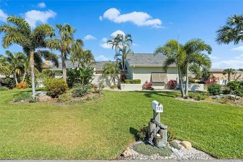 a view of a house with a backyard porch and sitting area