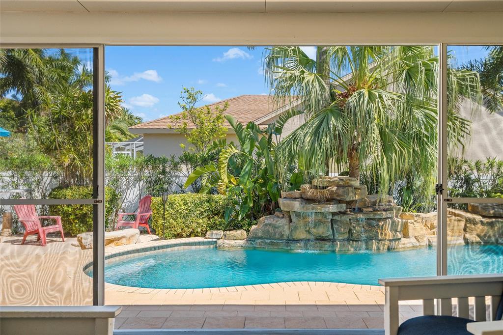 725 Monte Cristo Boulevard Tierra Verde, FL 33715 - Photo 13 of 63 a view of swimming pool with lawn chairs and plants
